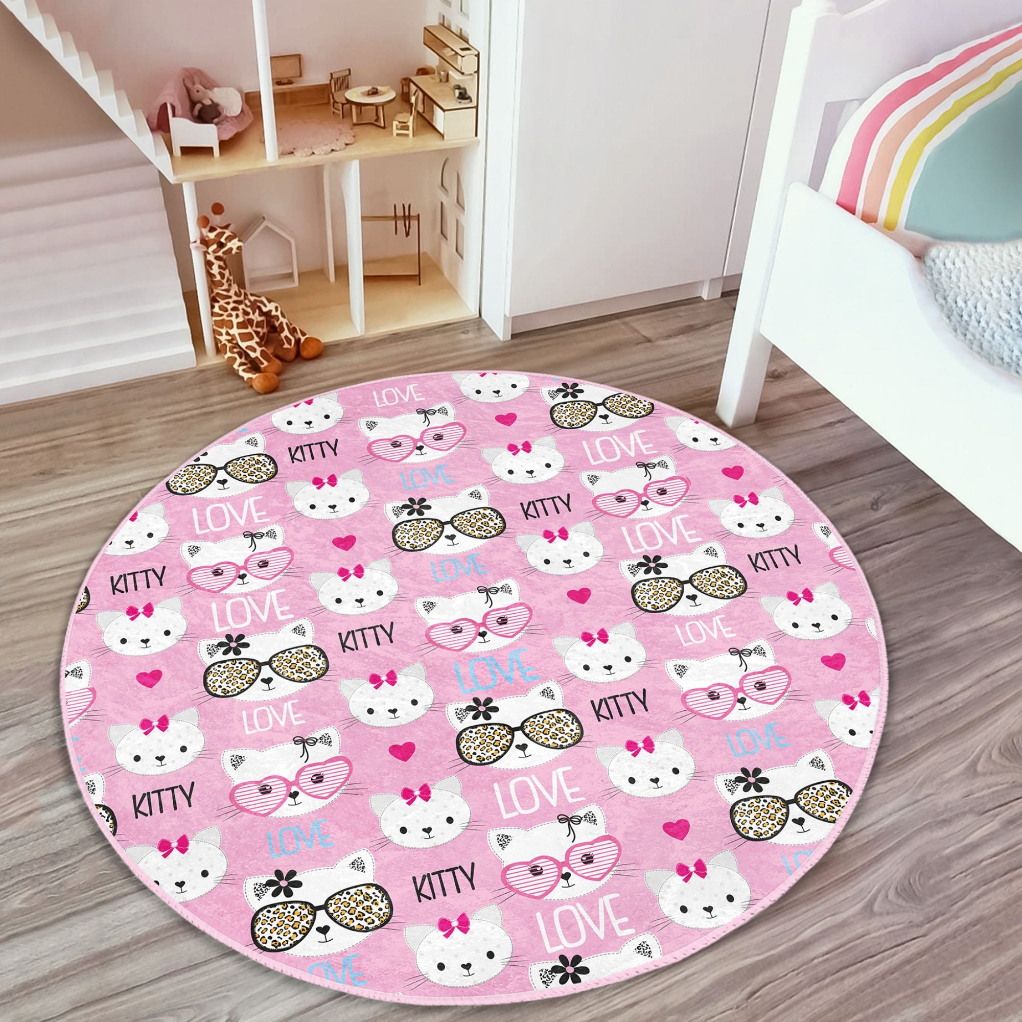 Lovely pink round rug featuring a playful kitty pattern, perfect for kids' rooms, made from soft velvet fabric.