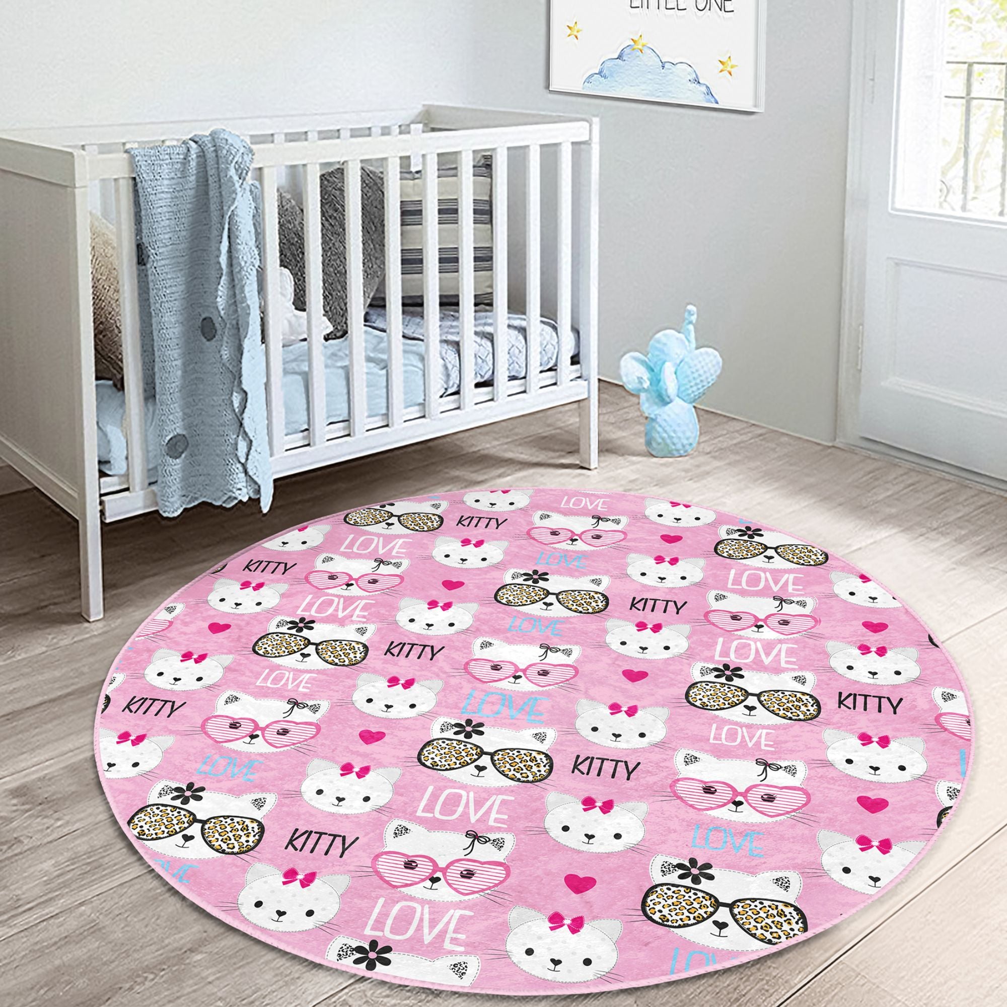 Lovely pink round rug featuring a playful kitty pattern, perfect for kids' rooms, made from soft velvet fabric.