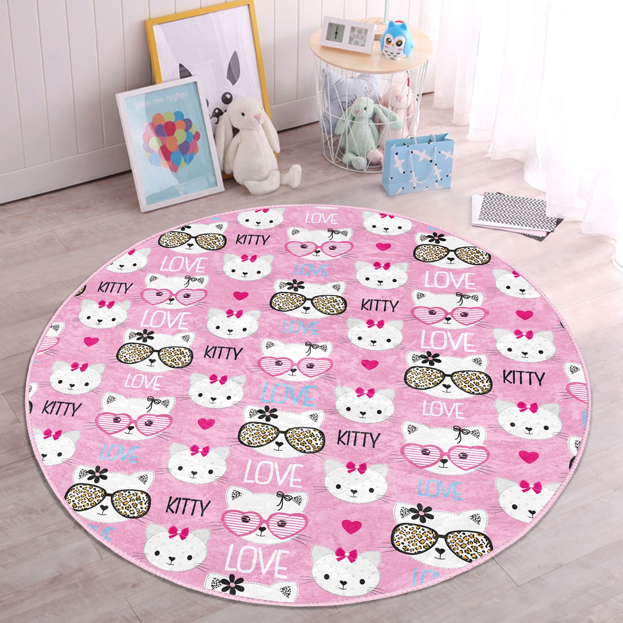 Lovely pink round rug featuring a playful kitty pattern, perfect for kids' rooms, made from soft velvet fabric.