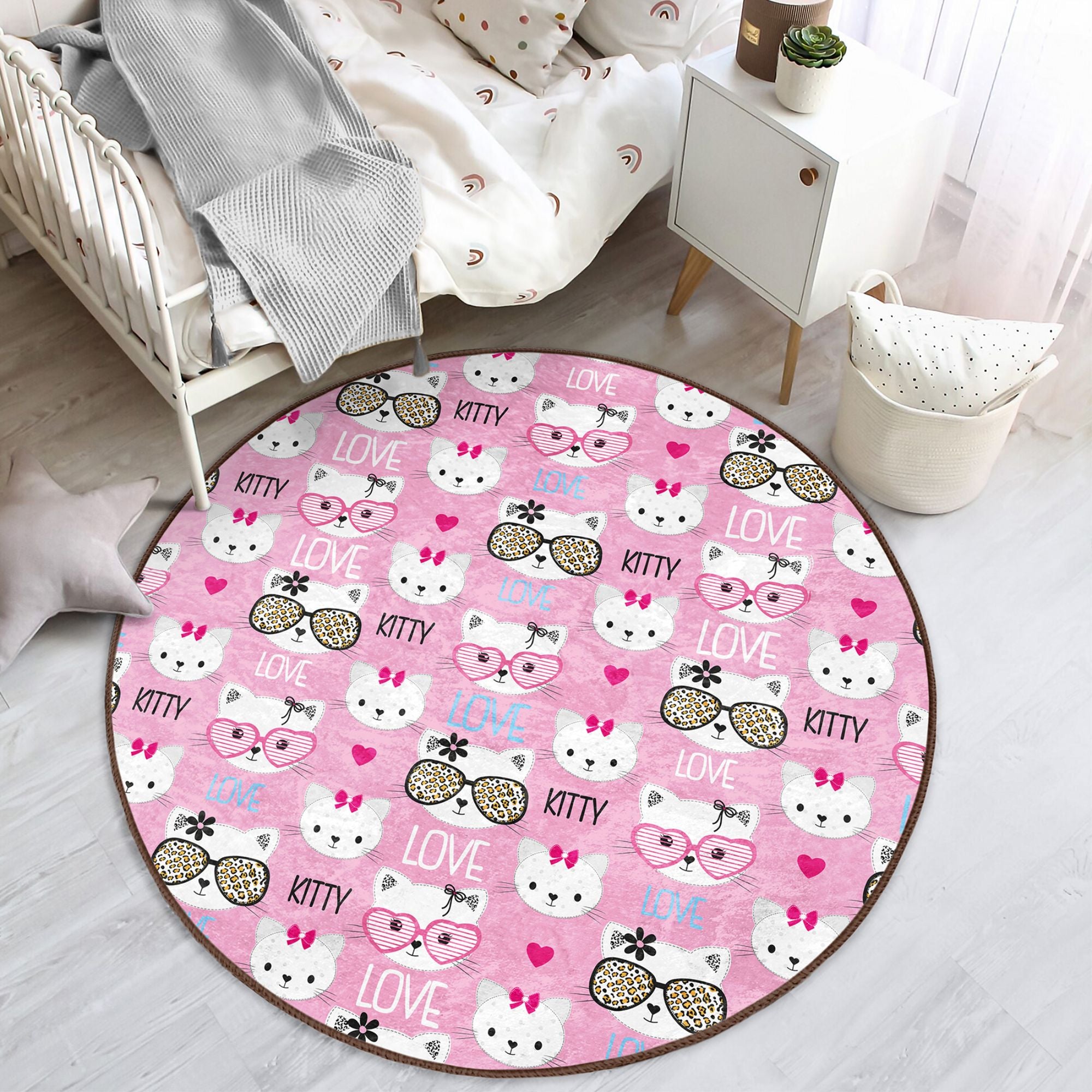 Lovely pink round rug featuring a playful kitty pattern, perfect for kids' rooms, made from soft velvet fabric.