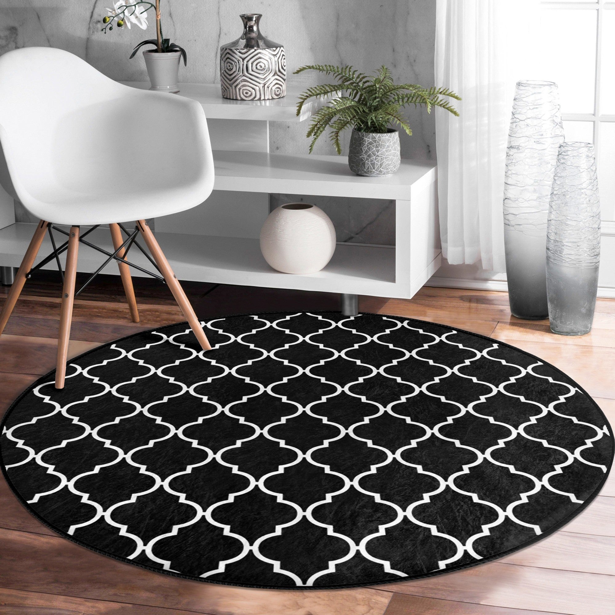 Luxury round rug in black and white design, showcasing a modern and elegant pattern, perfect for living room decor.