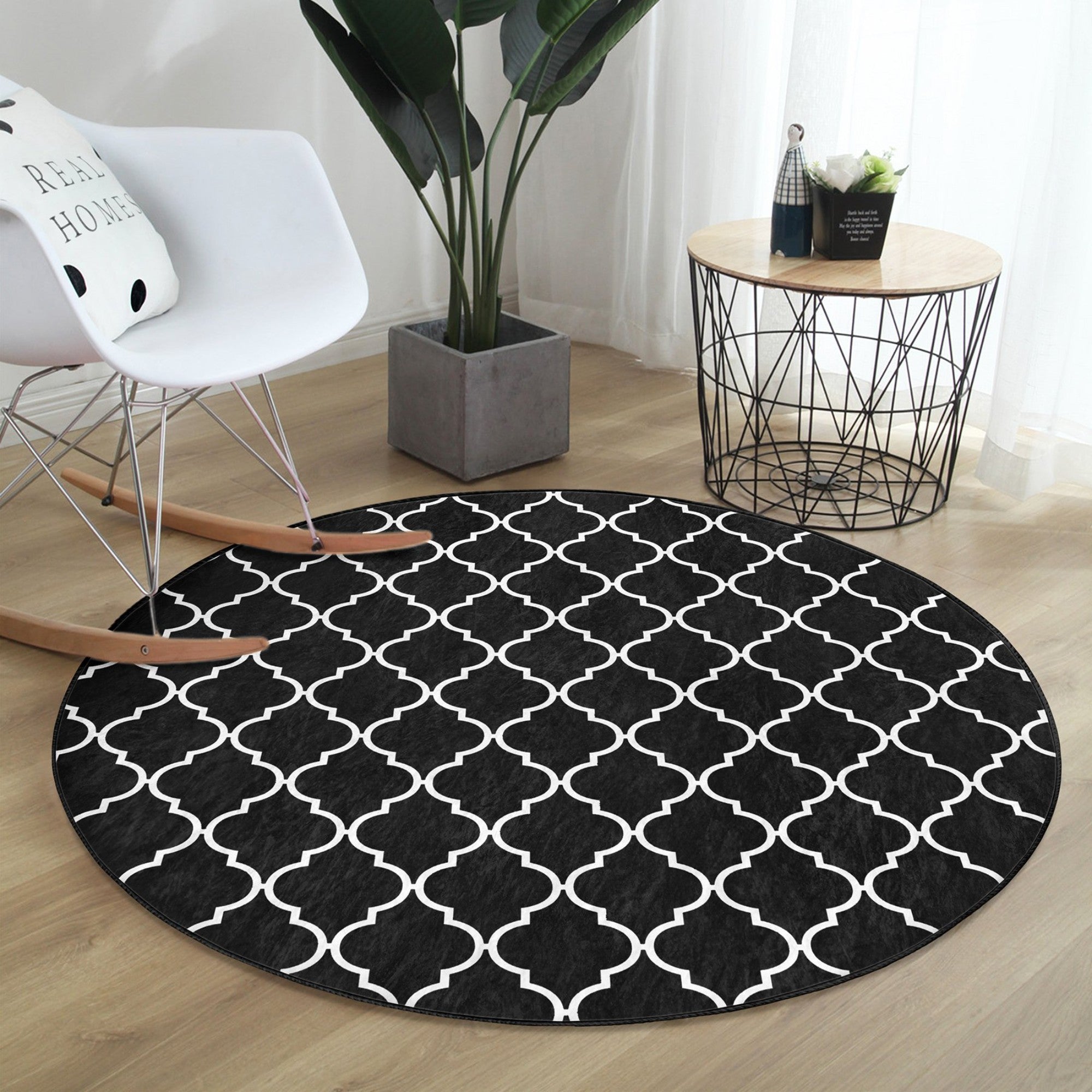 Luxury round rug in black and white design, showcasing a modern and elegant pattern, perfect for living room decor.