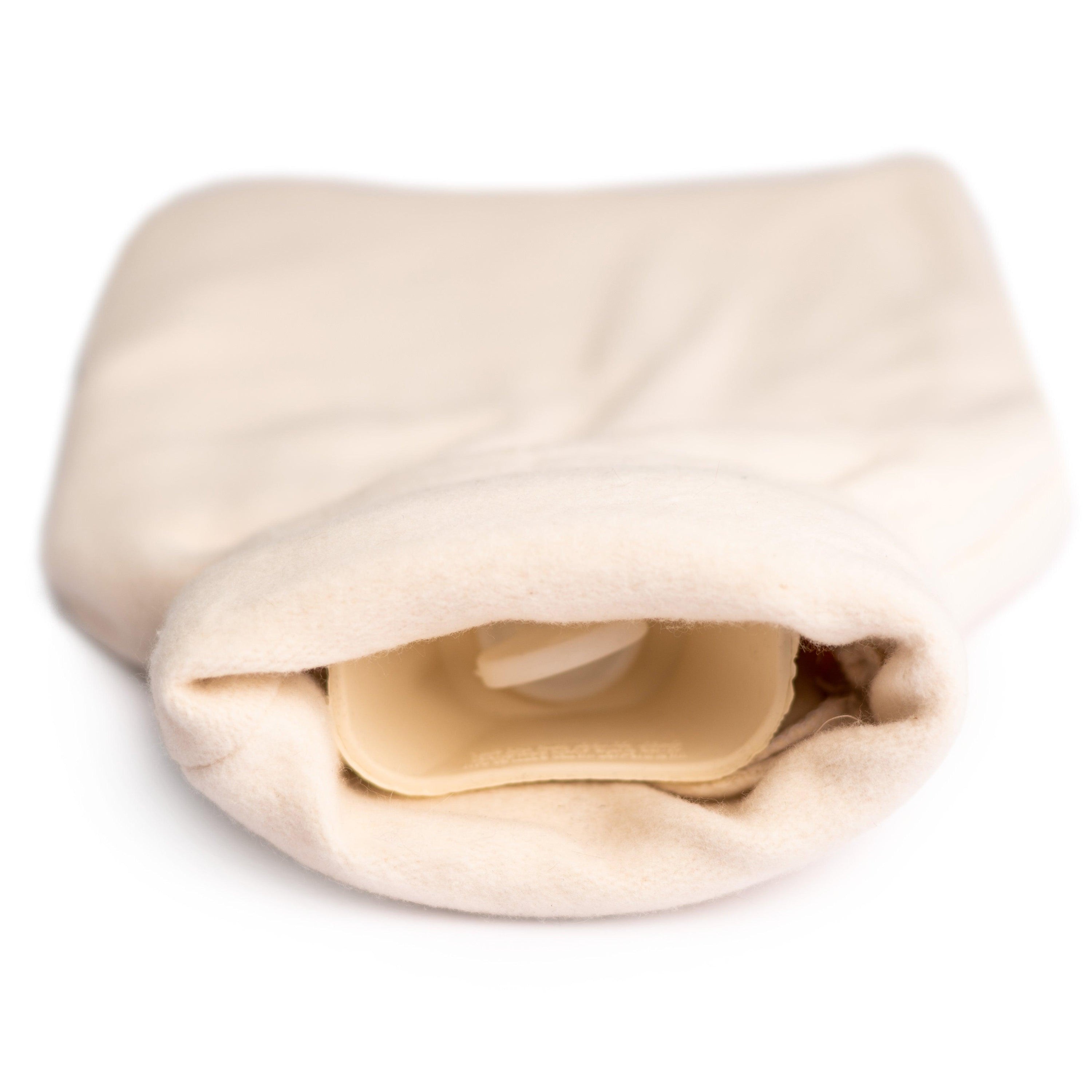 Luxury Natural Bamboo Hot Water Bottle with a handmade roll-neck cover, showcasing its eco-friendly materials and stylish design.