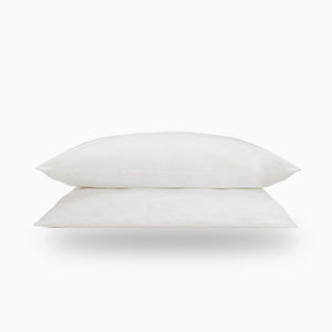 Luxury organic cotton pillow case in white, showcasing its soft texture and breathable percale weave, perfect for a comfortable night's sleep.