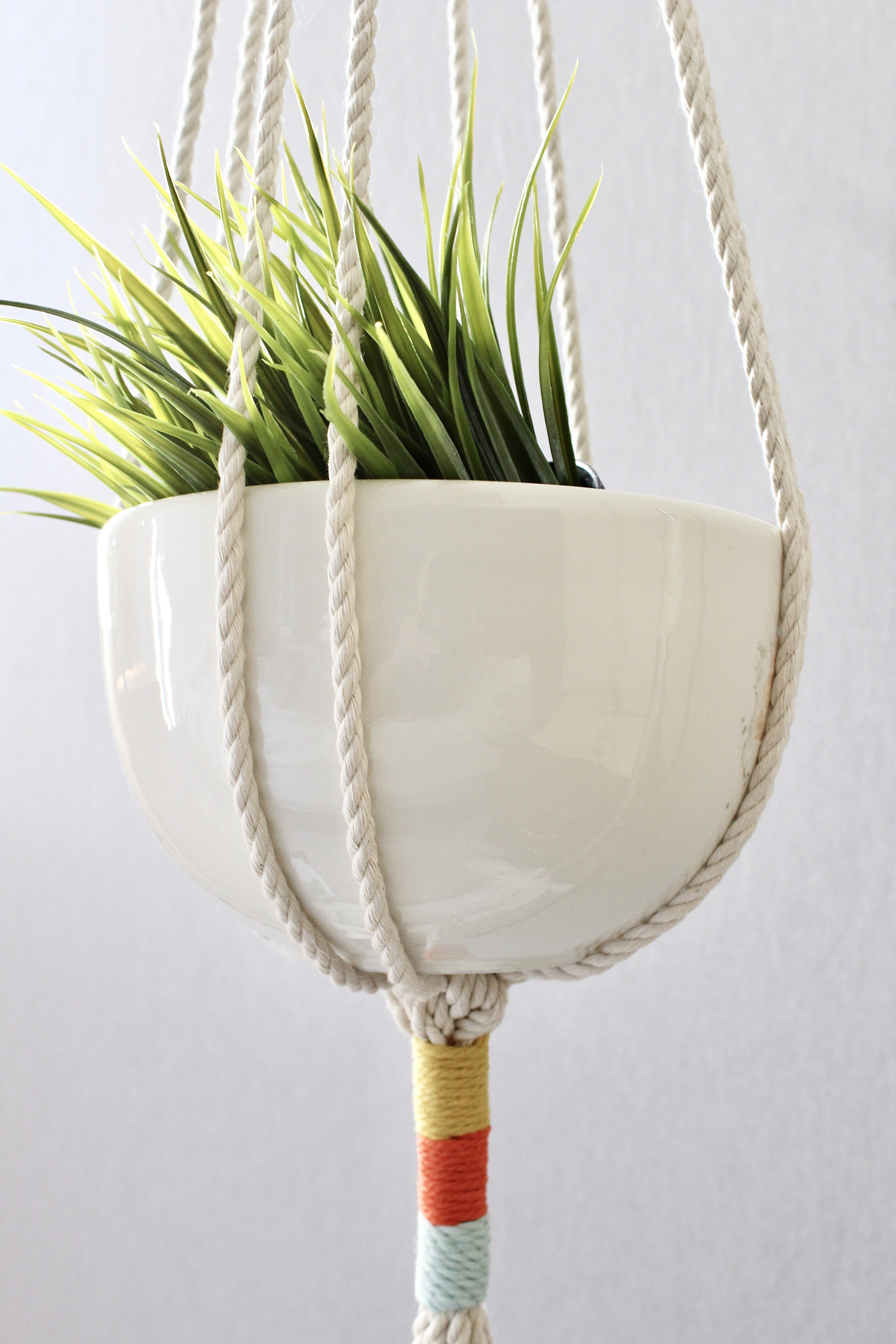 Color Block Macrame Plant Hanger made from natural cotton rope, showcasing a stylish design for indoor plants.