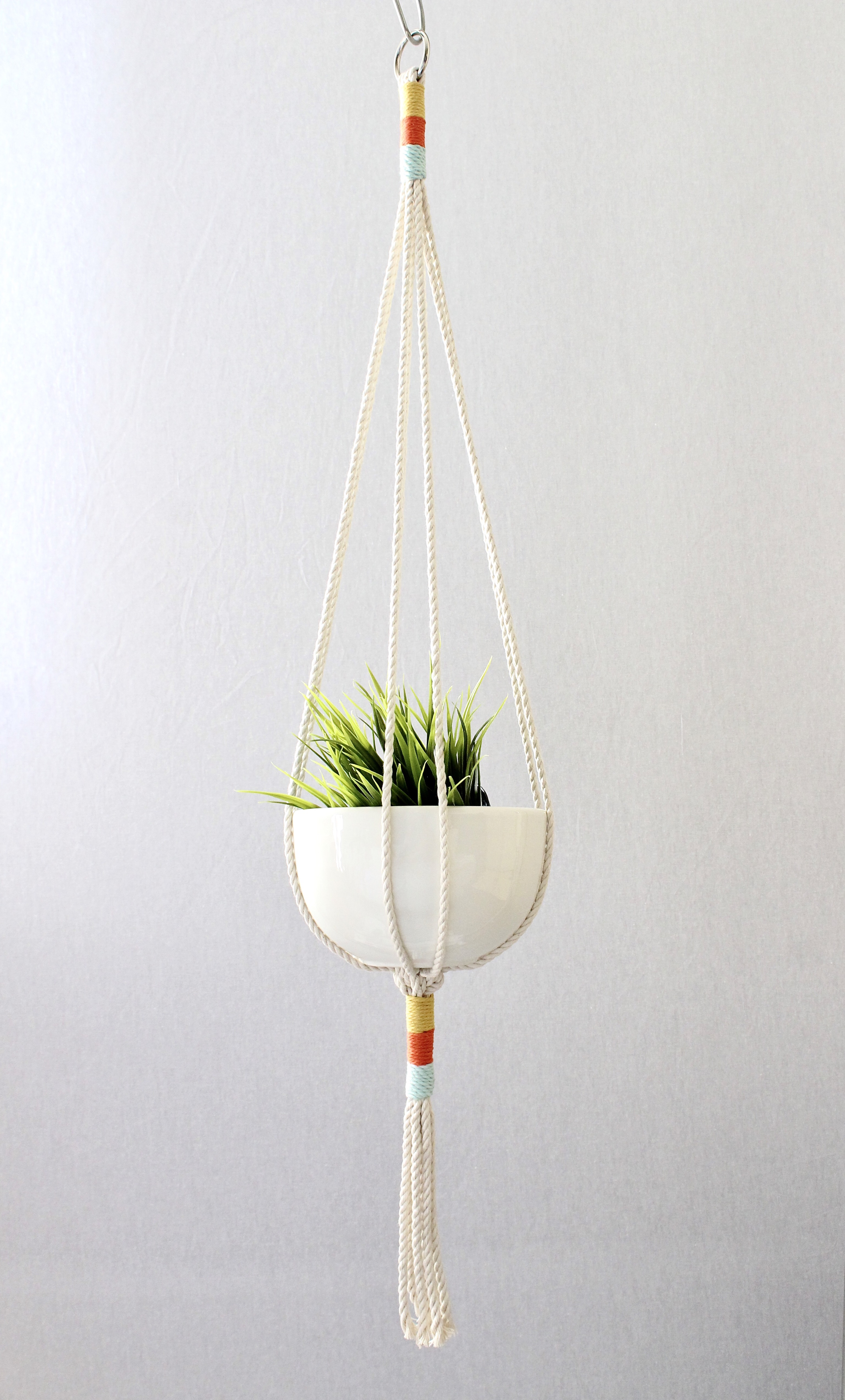 Color Block Macrame Plant Hanger made from natural cotton rope, showcasing a stylish design for indoor plants.