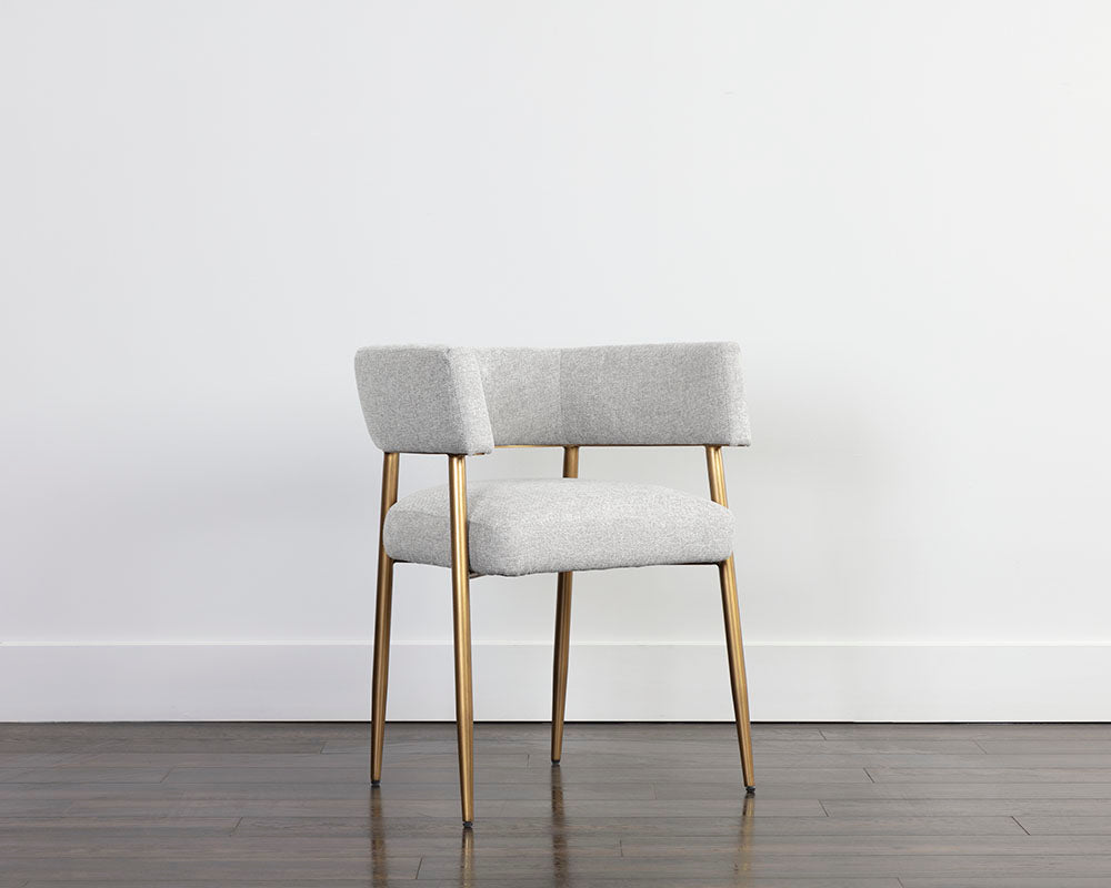 Maestro Dining Armchair in Belfast Heather Grey with antique brass legs, showcasing a contemporary design and curved frame.