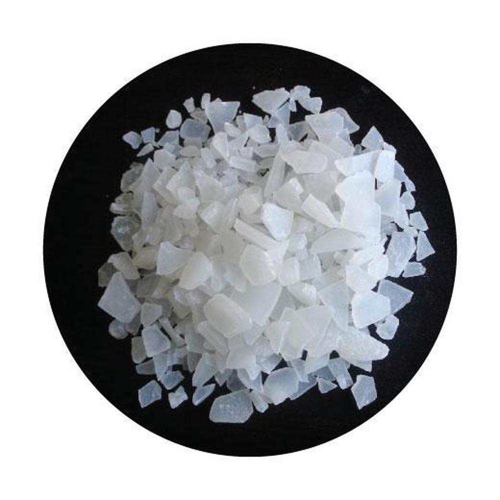 A bag of Magnesium Chloride Flakes Hexahydrate, showcasing the pure white crystalline flakes ideal for therapeutic baths.