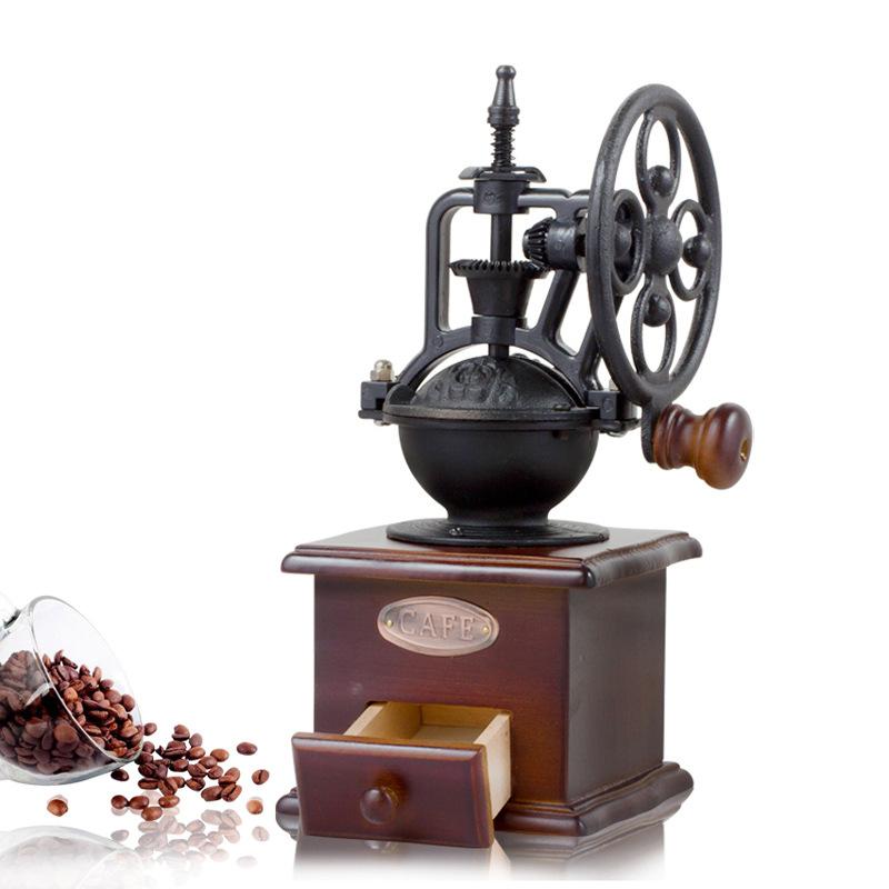 Vintage style manual coffee grinder made of pine wood with a ceramic core and cast iron hand crank, showcasing its elegant design and functionality.