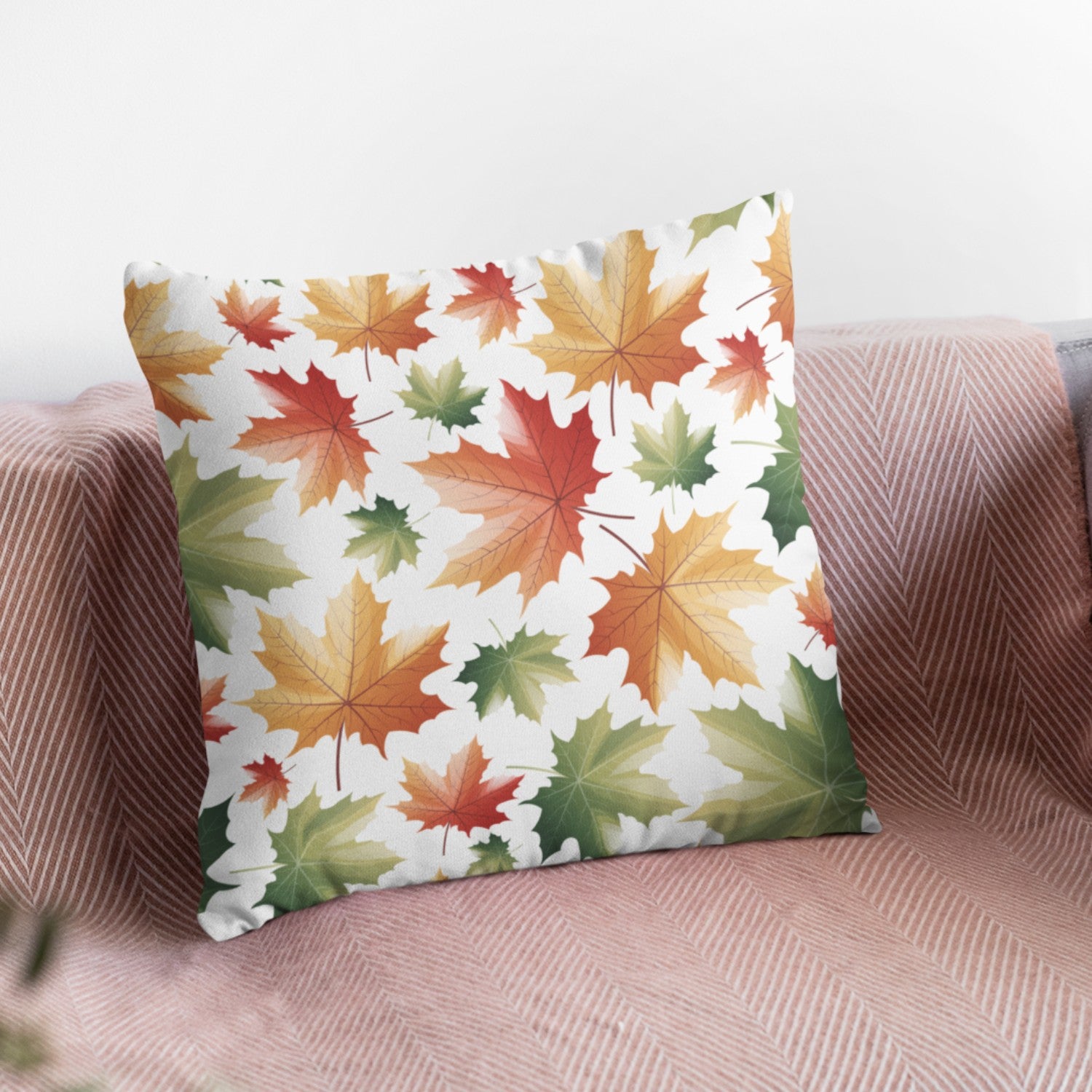 Maple Leaf Pattern Throw Pillow by Homeezone featuring vibrant maple leaf design on one side and light cream back.