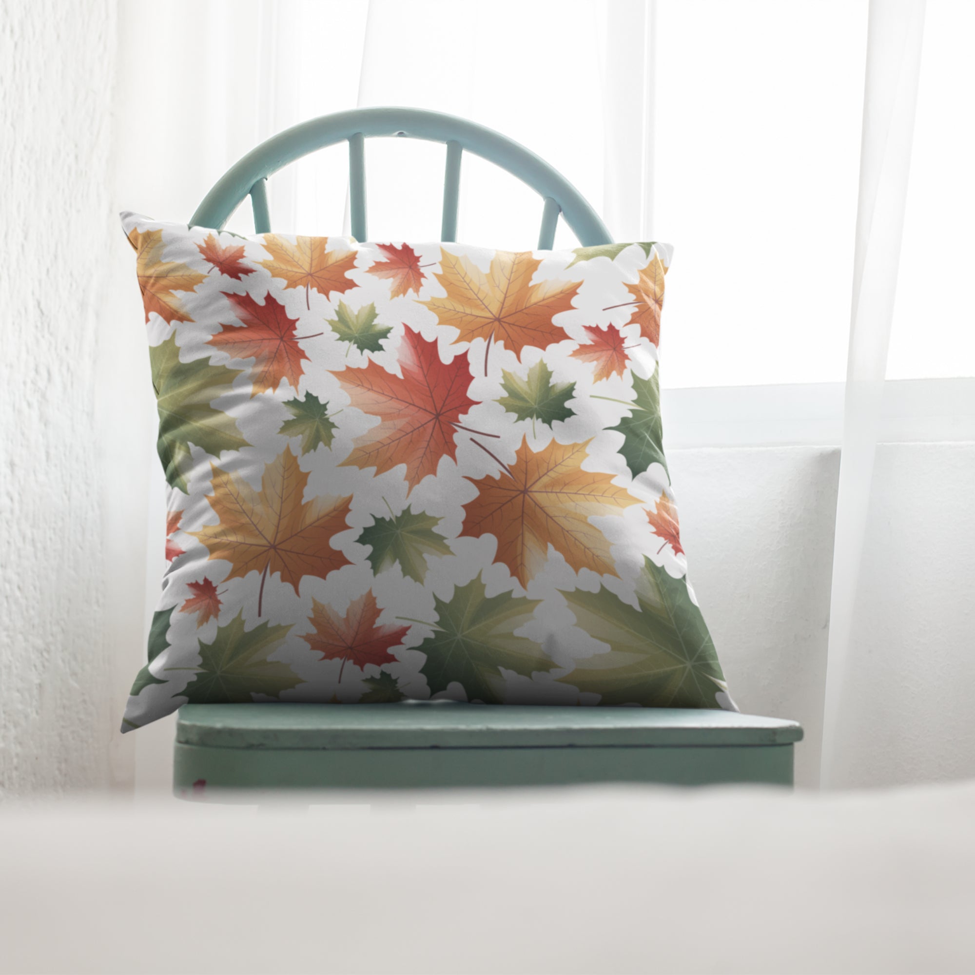 Maple Leaf Pattern Throw Pillow by Homeezone featuring vibrant maple leaf design on one side and light cream back.