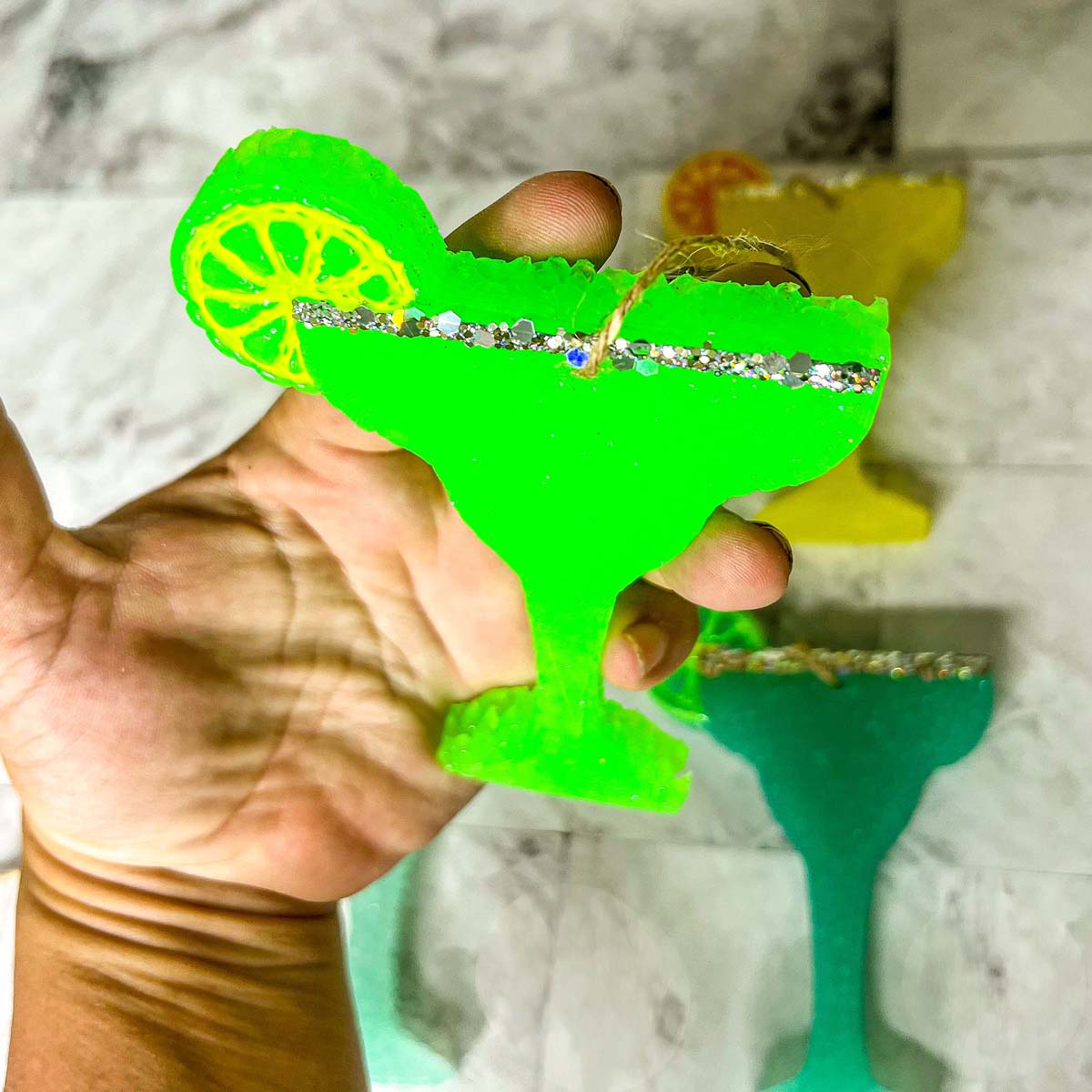 Margarita Freshie car air freshener in vibrant colors, shaped like a margarita glass, adding a festive touch to any vehicle.