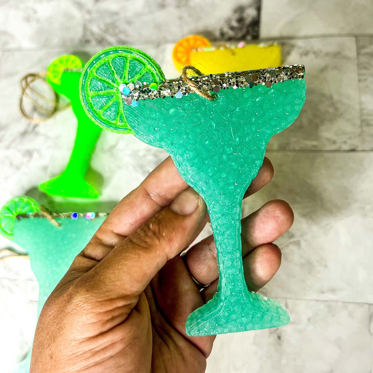 Margarita Freshie car air freshener in vibrant colors, shaped like a margarita glass, adding a festive touch to any vehicle.