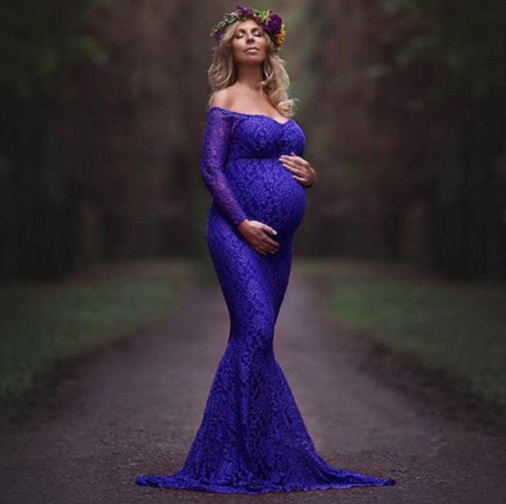 Elegant maternity fitted lace gown with an extended train, perfect for bridal shows and photography sessions.