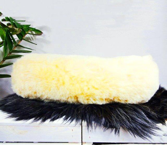 A soft Medical Sheepskin Pillow made from natural sheep fur, designed for neck support during travel.