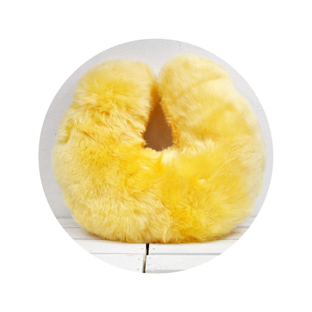 Medical Sheepskin Travel Pillow in a soft, natural sheep fur design, ideal for neck support during travel.