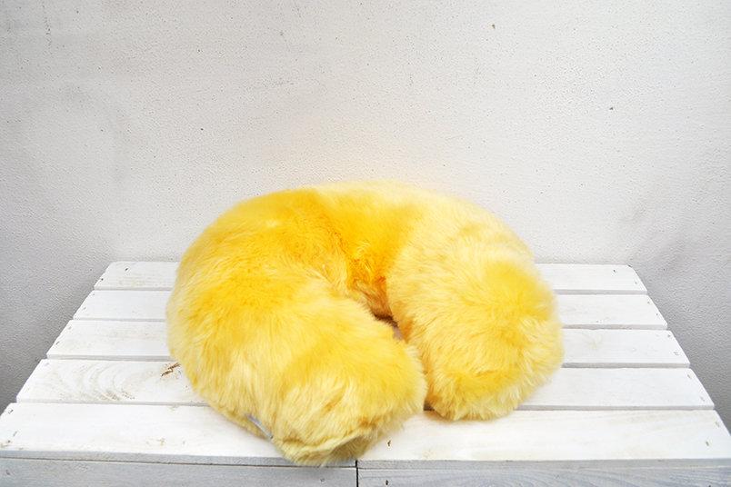 Medical Sheepskin Travel Pillow in a soft, natural sheep fur design, ideal for neck support during travel.