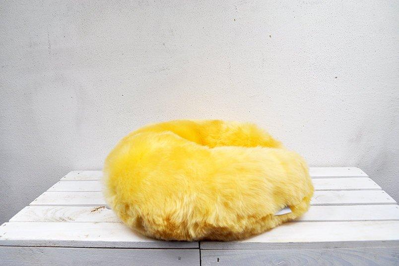 Medical Sheepskin Travel Pillow in a soft, natural sheep fur design, ideal for neck support during travel.