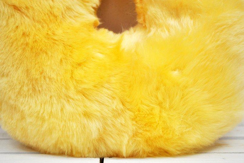 Medical Sheepskin Travel Pillow in a soft, natural sheep fur design, ideal for neck support during travel.