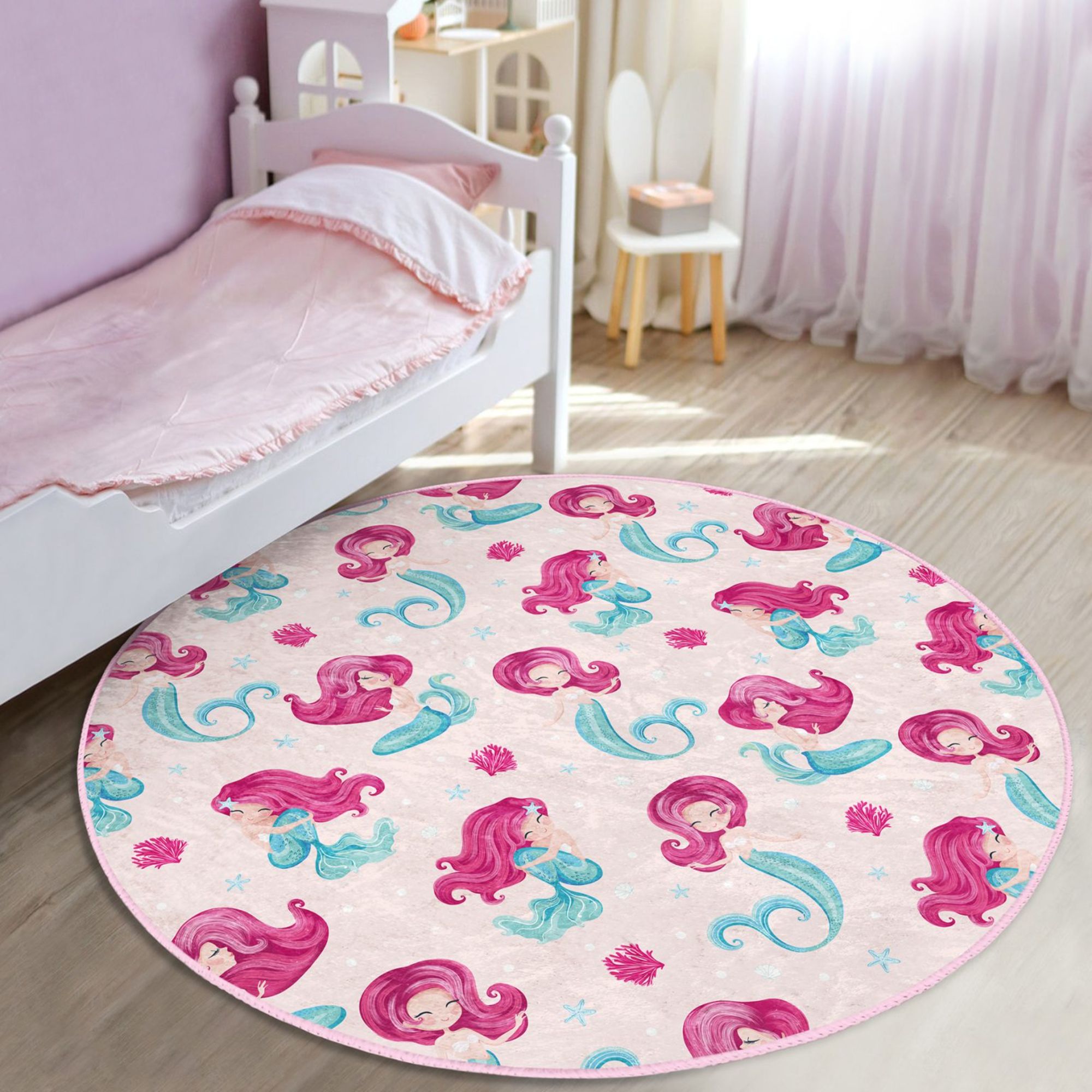 A vibrant pink washable rug featuring a whimsical mermaid design, perfect for a girl's bedroom, made from soft and durable materials.