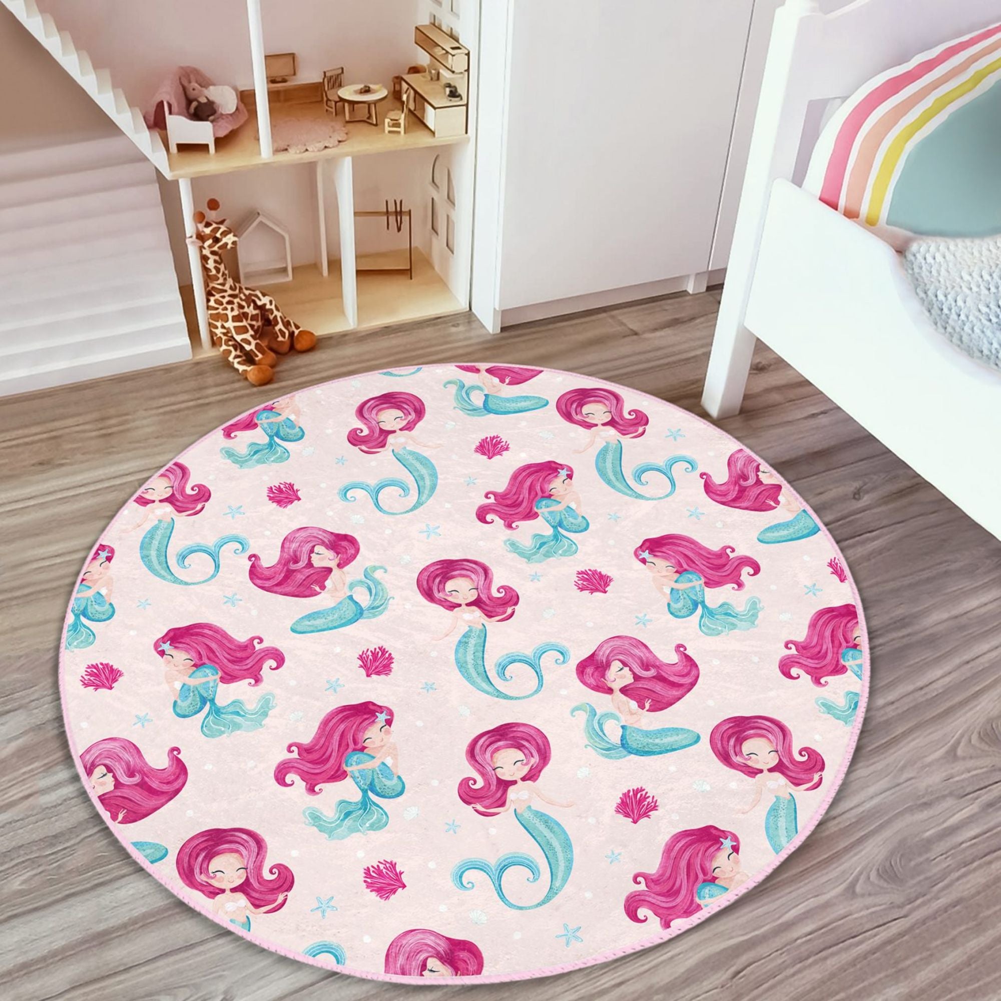 A vibrant pink washable rug featuring a whimsical mermaid design, perfect for a girl's bedroom, made from soft and durable materials.