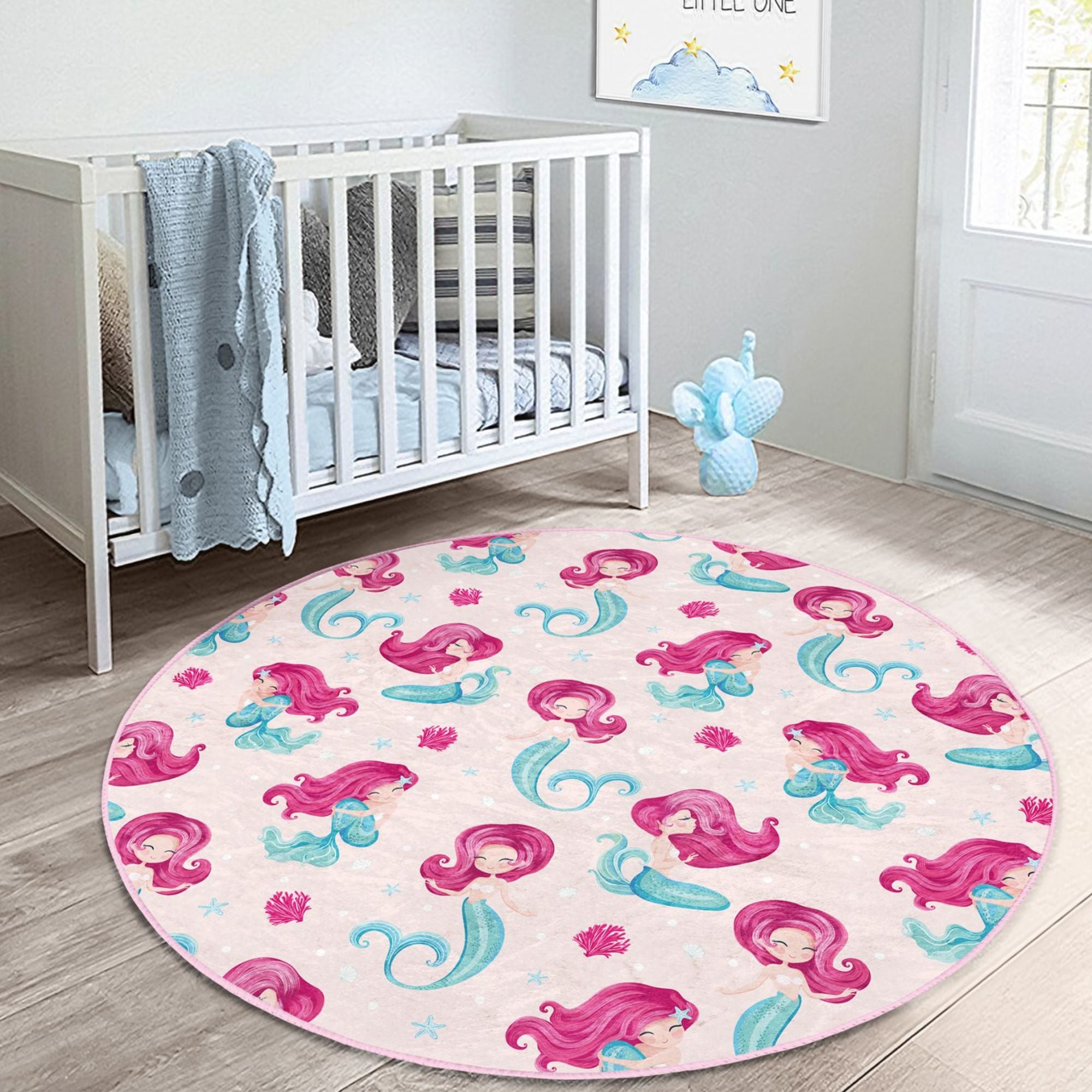 A vibrant pink washable rug featuring a whimsical mermaid design, perfect for a girl's bedroom, made from soft and durable materials.