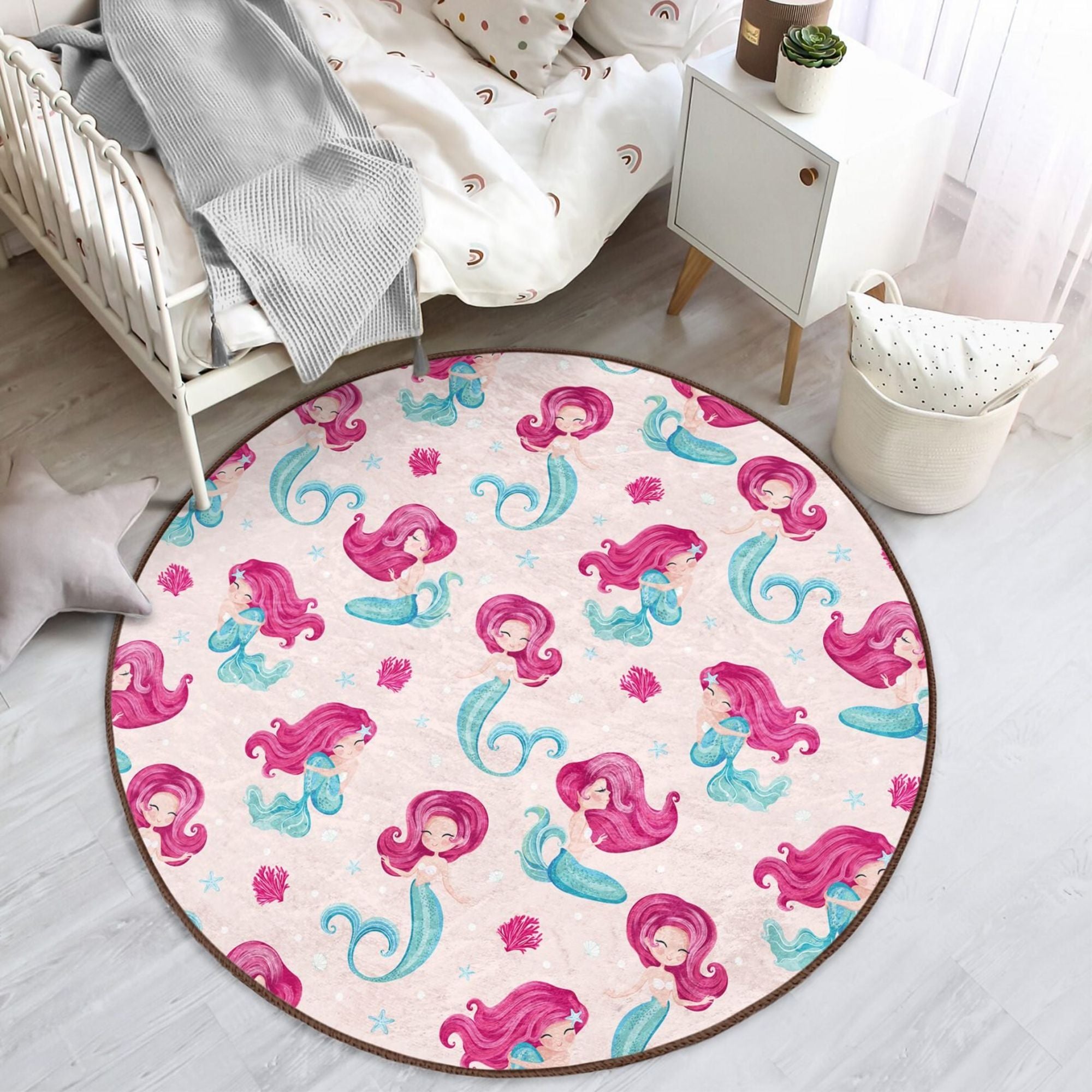 A vibrant pink washable rug featuring a whimsical mermaid design, perfect for a girl's bedroom, made from soft and durable materials.