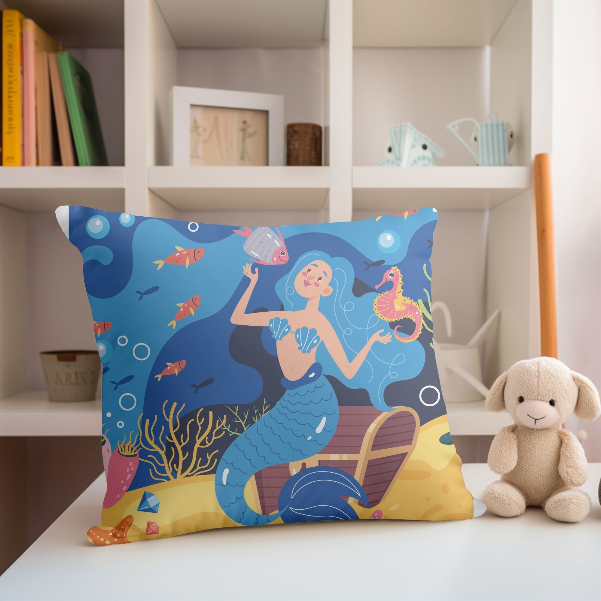 A colorful pillow featuring a vibrant mermaid pattern, perfect for girls' rooms, with a light cream back.