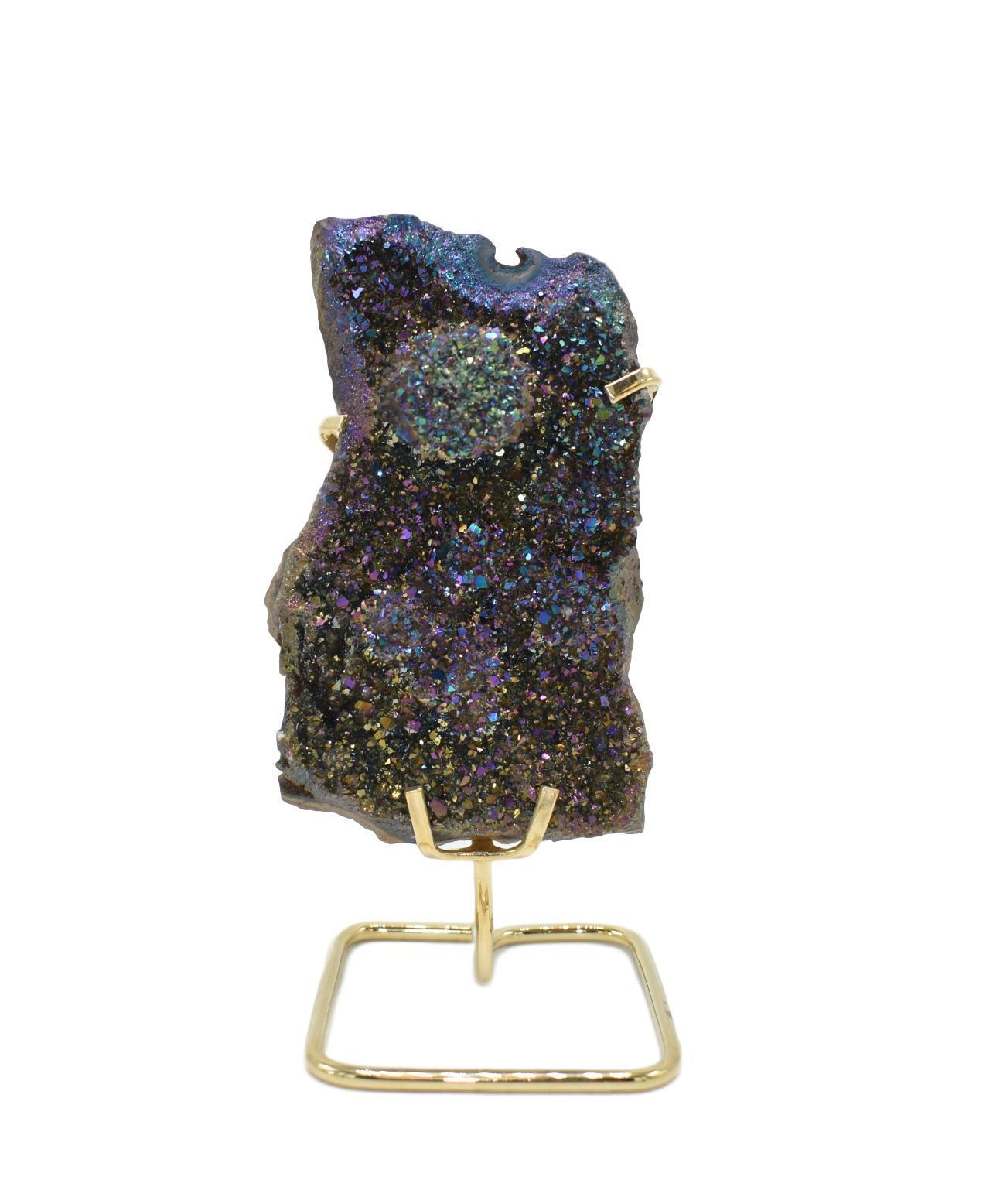 A large metalized amethyst cluster mounted on a sleek wire stand, showcasing vibrant purple hues and a shiny metallic finish.