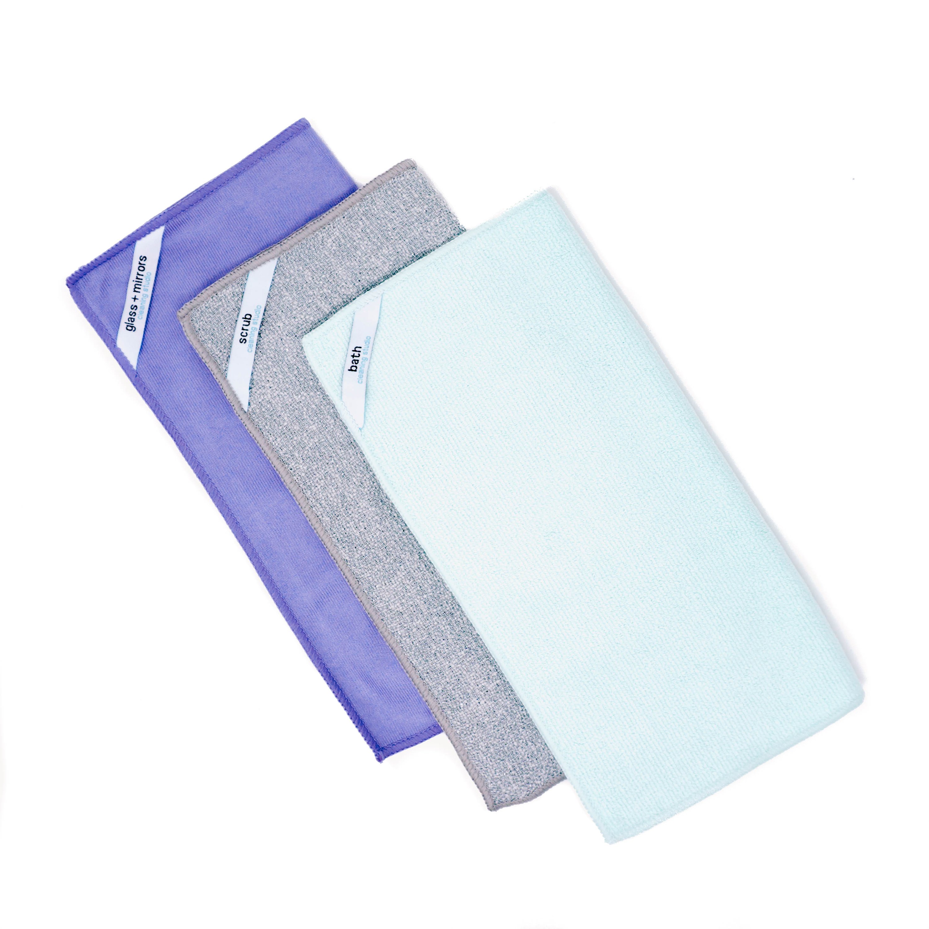 Three assorted microfiber cleaning cloths designed for bathroom cleaning, featuring color-coded tags for specific tasks and corner tags for easy hanging.