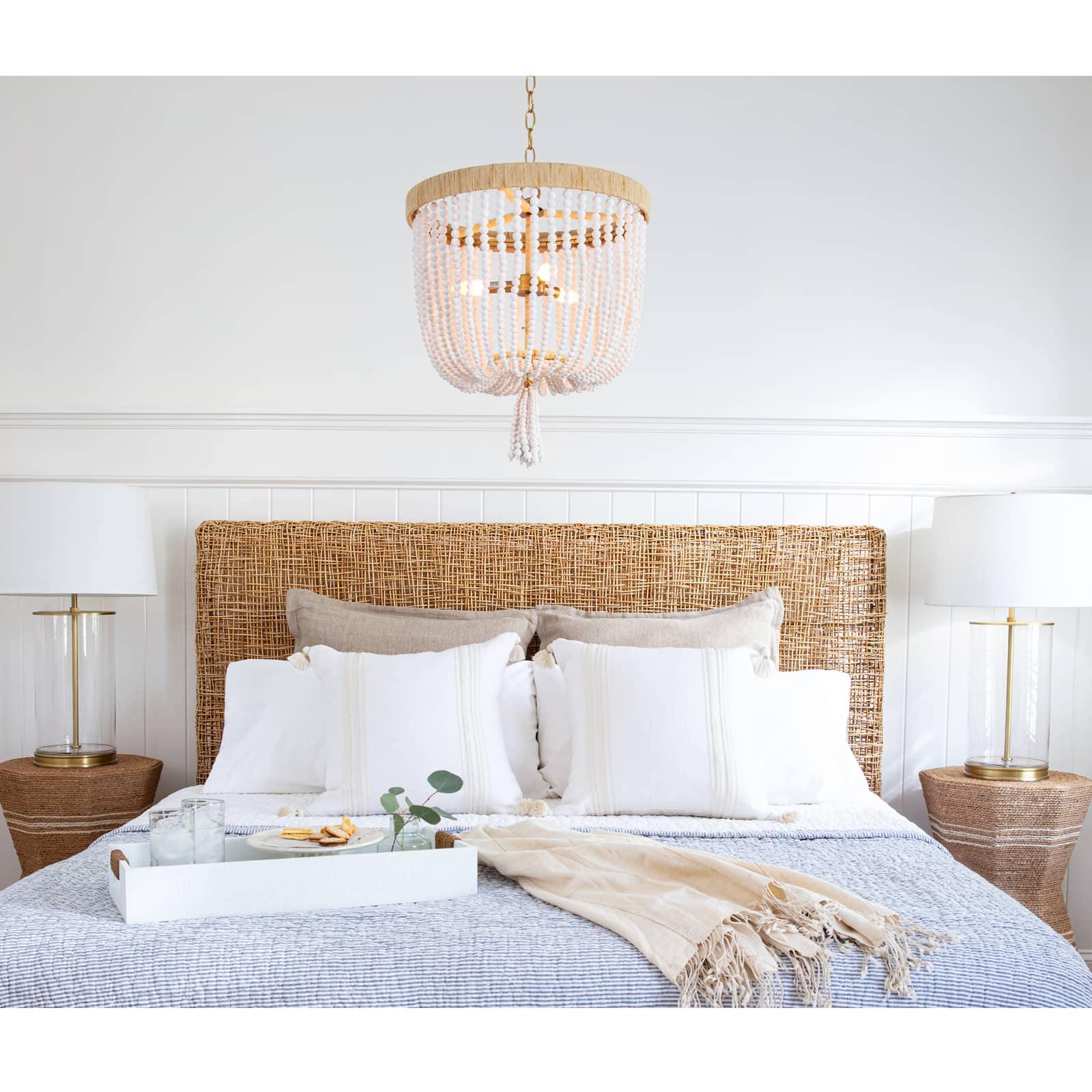 Milos Chandelier featuring a rattan-wrapped frame and white finish, perfect for coastal and farmhouse decor.