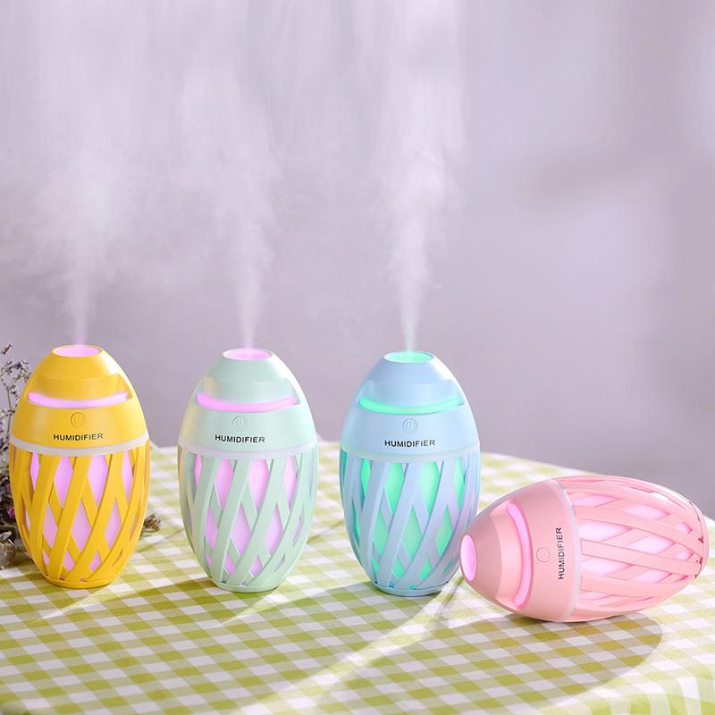 Mini USB Air Humidifier Essential Oil Diffuser in yellow, featuring a cartoon design and LED lights, perfect for aromatherapy.