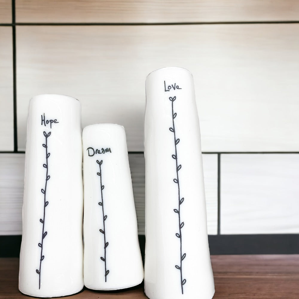 Mini Vase Gift Set featuring four unique porcelain vases in elegant designs, perfect for home decor or gifting.