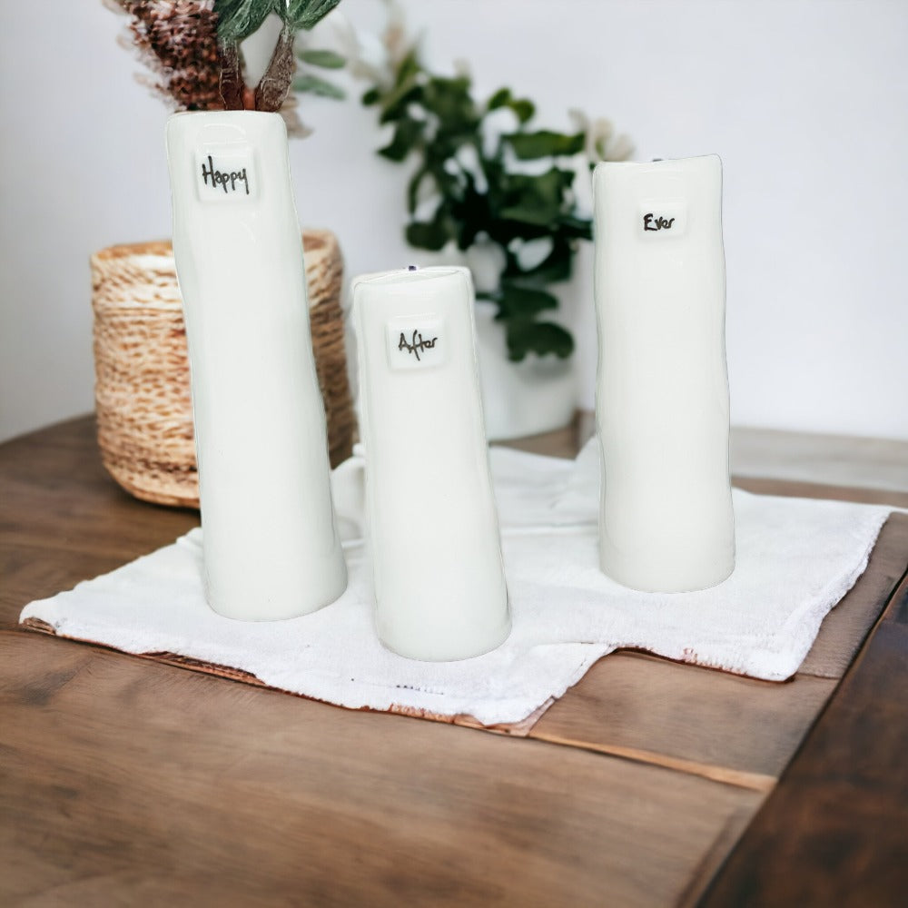 Mini Vase Gift Set featuring four unique porcelain vases in elegant designs, perfect for home decor or gifting.