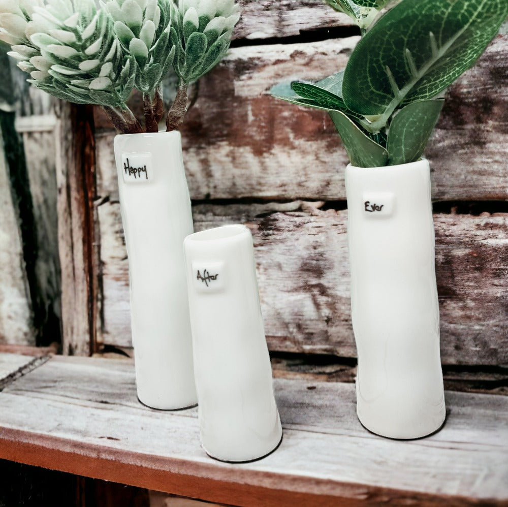 Mini Vase Gift Set featuring four unique porcelain vases in elegant designs, perfect for home decor or gifting.