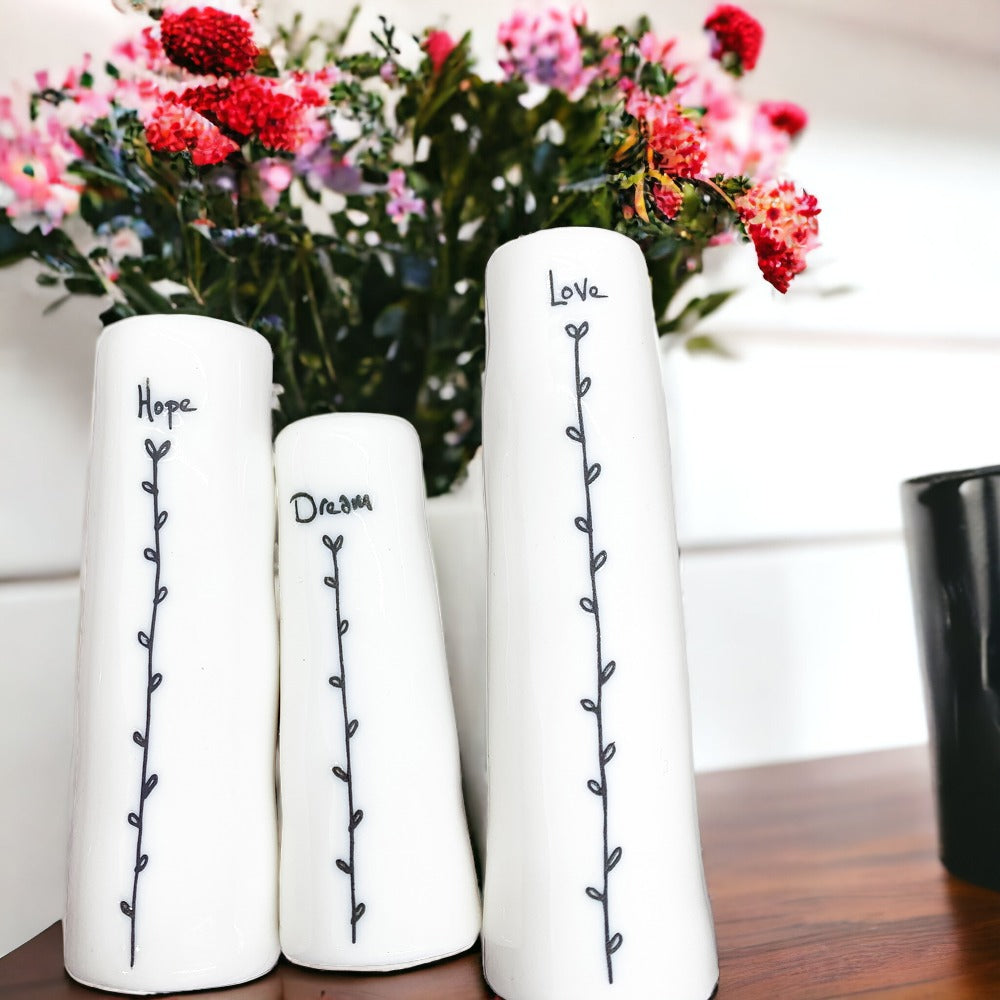 Mini Vase Gift Set featuring four unique porcelain vases in elegant designs, perfect for home decor or gifting.