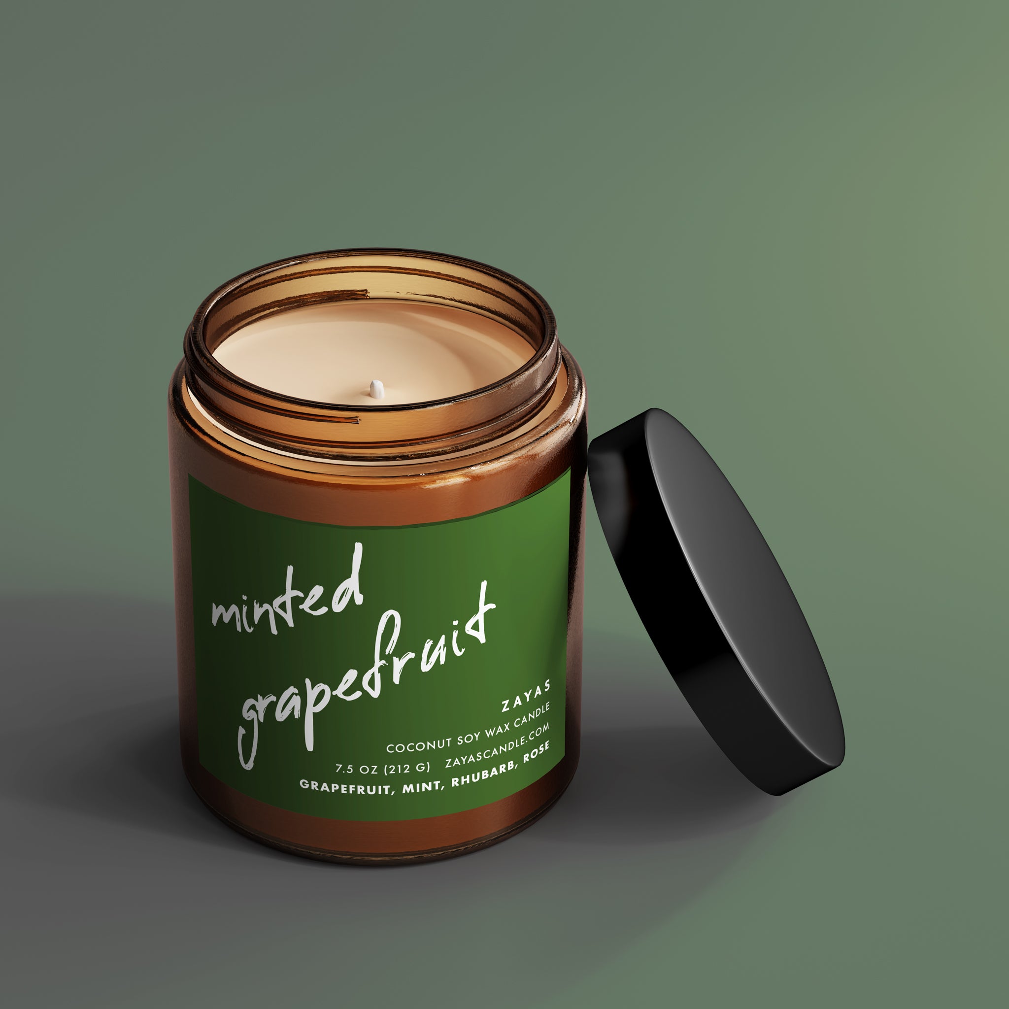 Minted Grapefruit candle in a reusable glass jar with a cotton wick, showcasing its vibrant scent notes.