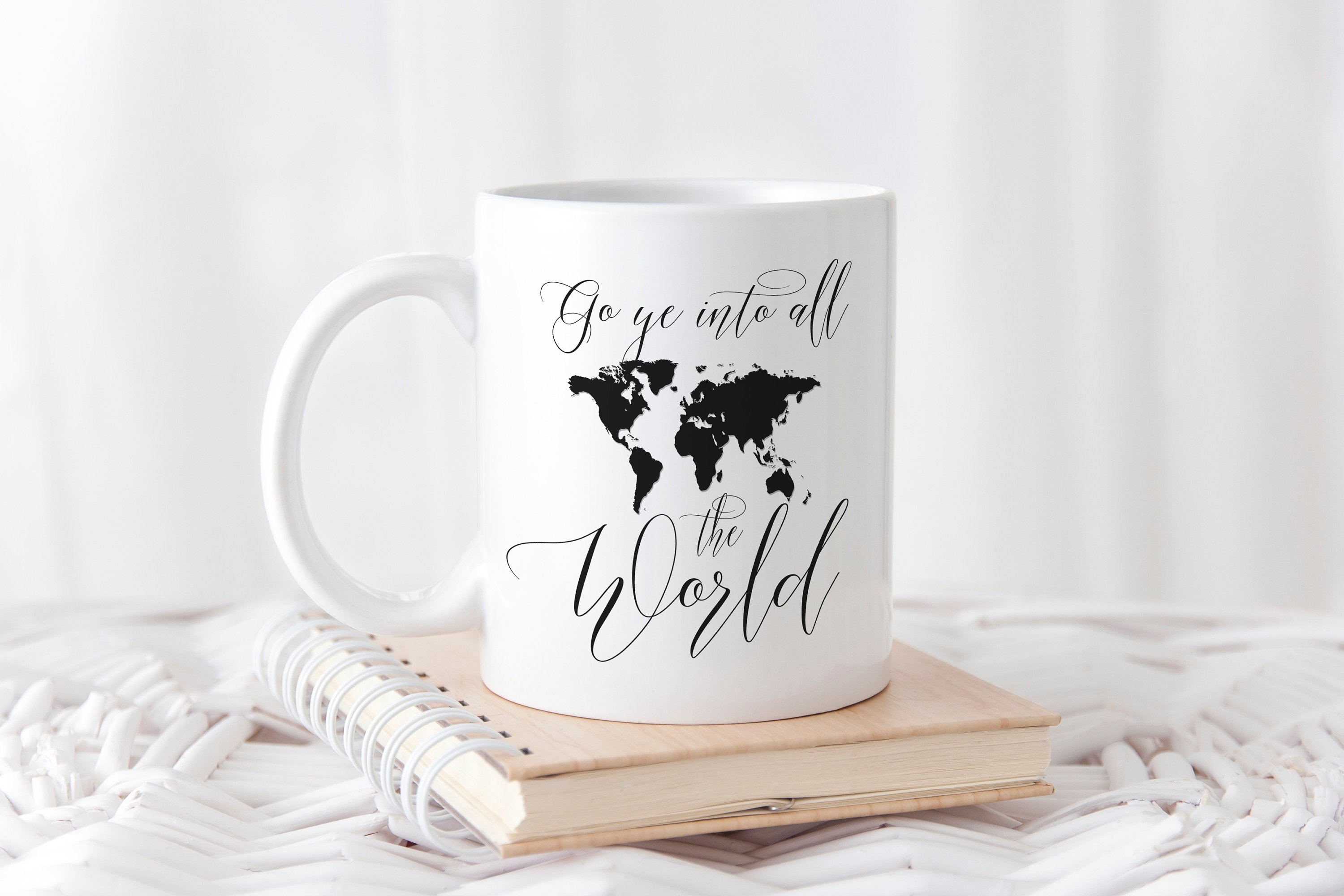 Personalized mug with 'Go Ye Into All the World' design, available in black and faux gold, showcasing both sides of the mug.