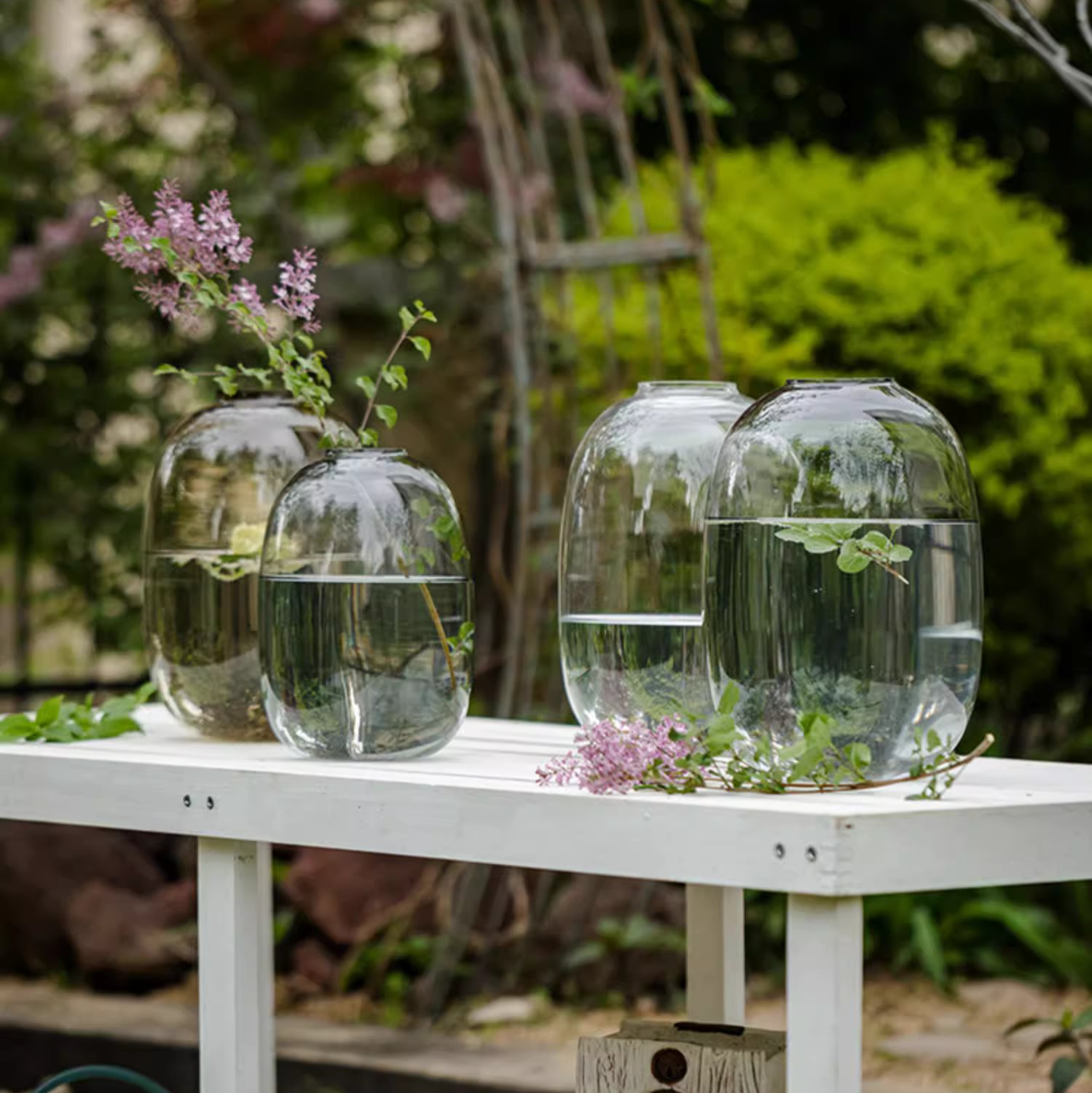 A modern clear glass vase in gray and yellow options, showcasing its elegant hand-blown design and perfect for floral arrangements.