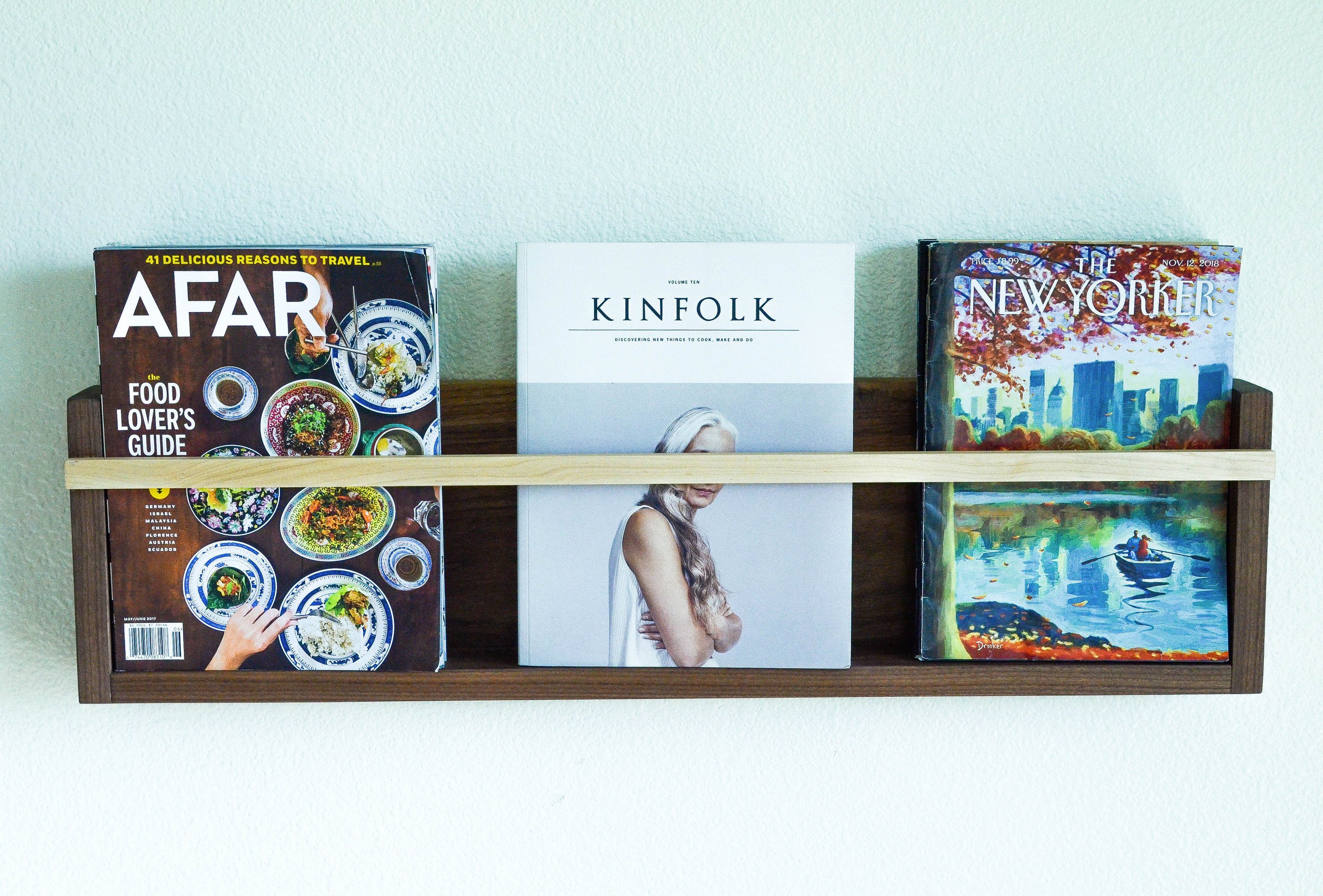 Modern Magazine & Vinyl Wall Rack made from Black Walnut and Maple, showcasing a sleek design for wall-mounted storage.