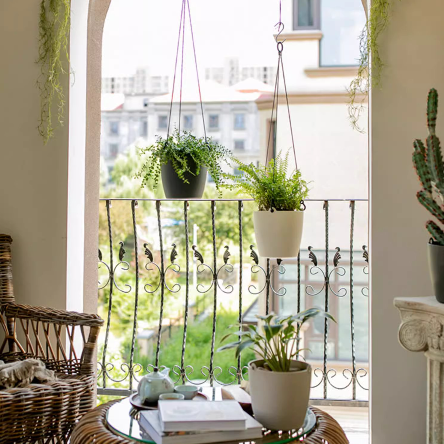 Modern resin hanging planter in black, light gray, and white, featuring a nylon rope and metal hook, designed for artificial plants.