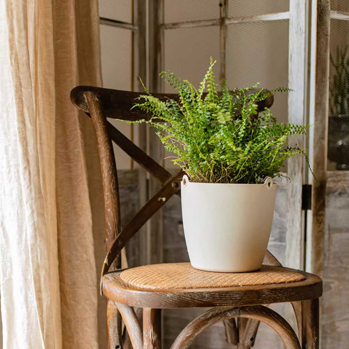 Modern resin hanging planter in black, light gray, and white, featuring a nylon rope and metal hook, designed for artificial plants.