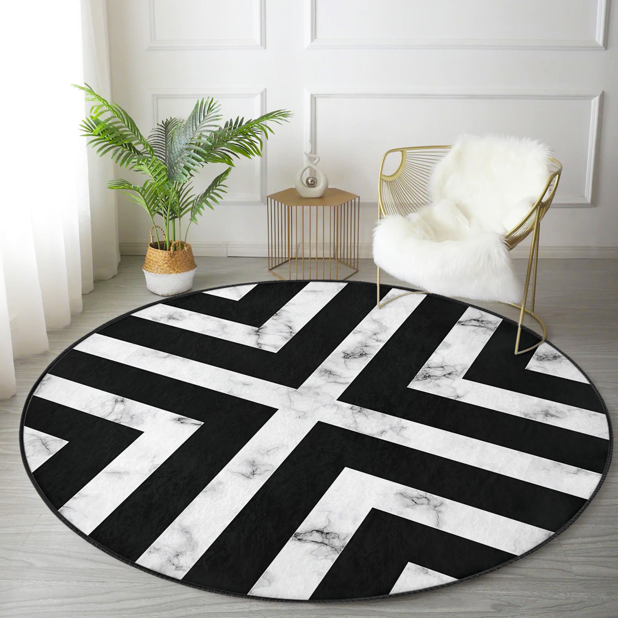 Modern round rug in black and white design, showcasing a soft velvet texture and non-slip backing, perfect for living room decor.