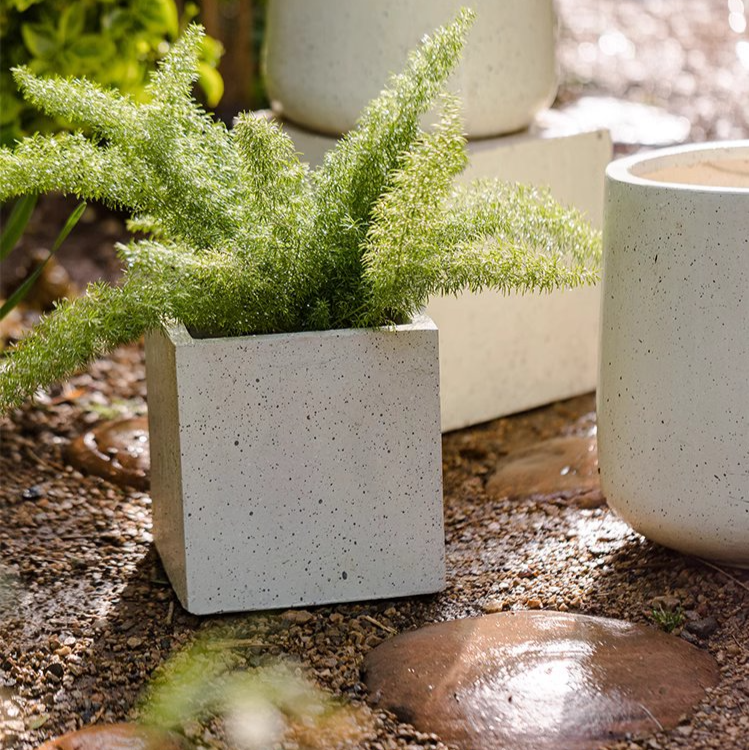 Modern White Square Planter made of magnesium oxide, featuring a sleek design and drainage hole, perfect for indoor and outdoor plants.