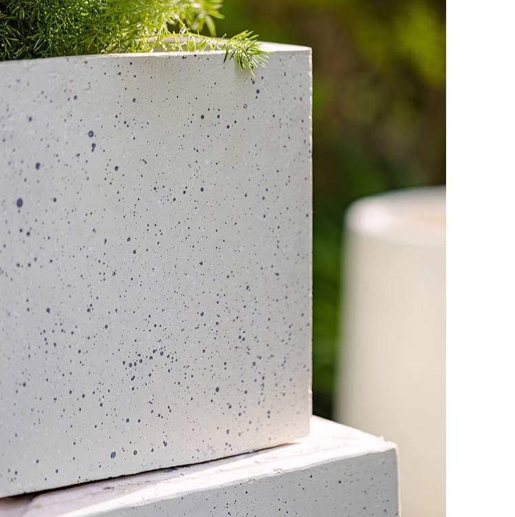 Modern White Square Planter made of magnesium oxide, featuring a sleek design and drainage hole, perfect for indoor and outdoor plants.