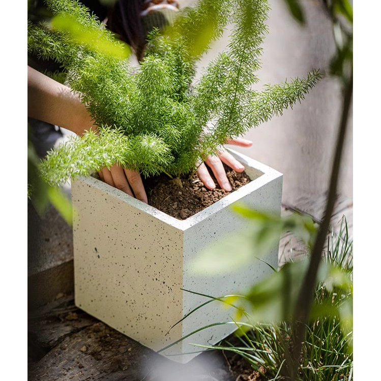 Modern White Square Planter made of magnesium oxide, featuring a sleek design and drainage hole, perfect for indoor and outdoor plants.