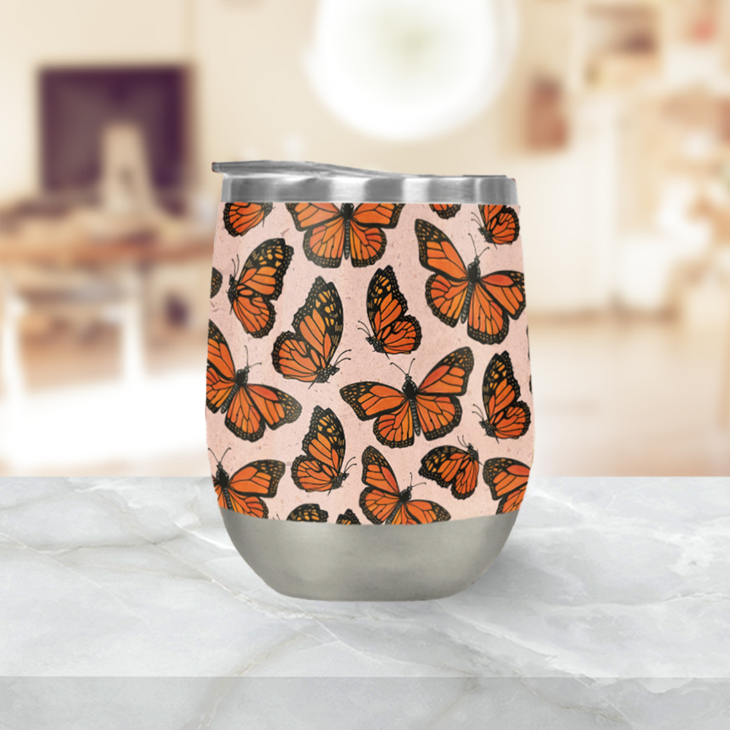 Monarch Butterfly Wine Tumbler showcasing a vibrant butterfly design, made of stainless steel with a double-wall vacuum insulation.