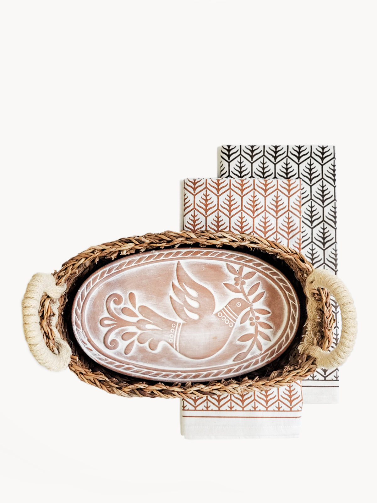 Monogrammed Bread Warmer and Basket Gift Set featuring a bird design, including a terracotta warmer, handwoven seagrass basket, and a cotton tea towel.