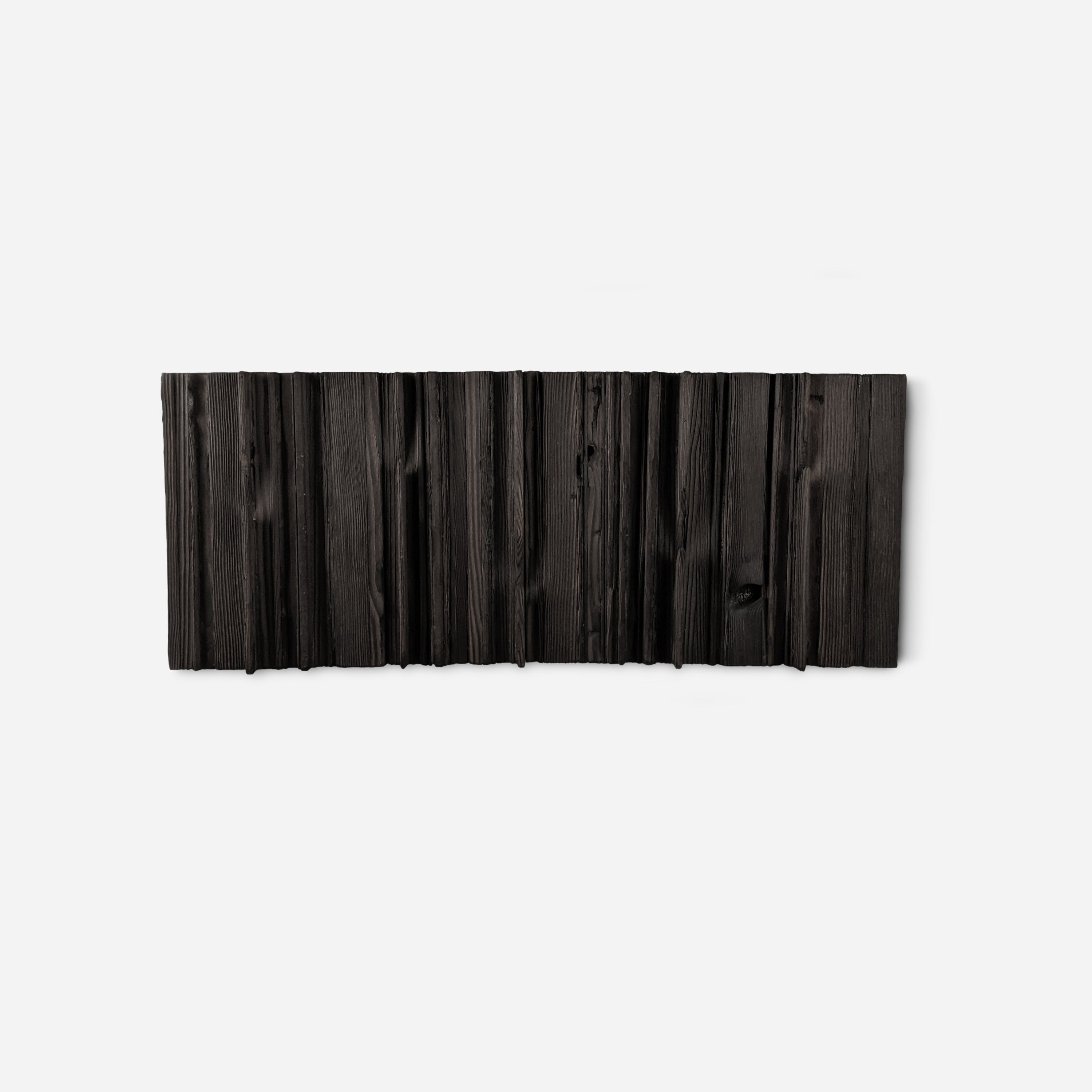 Mr. Hook coat rack featuring unique wood design with brass hooks, showcasing torched black and natural wood finish.