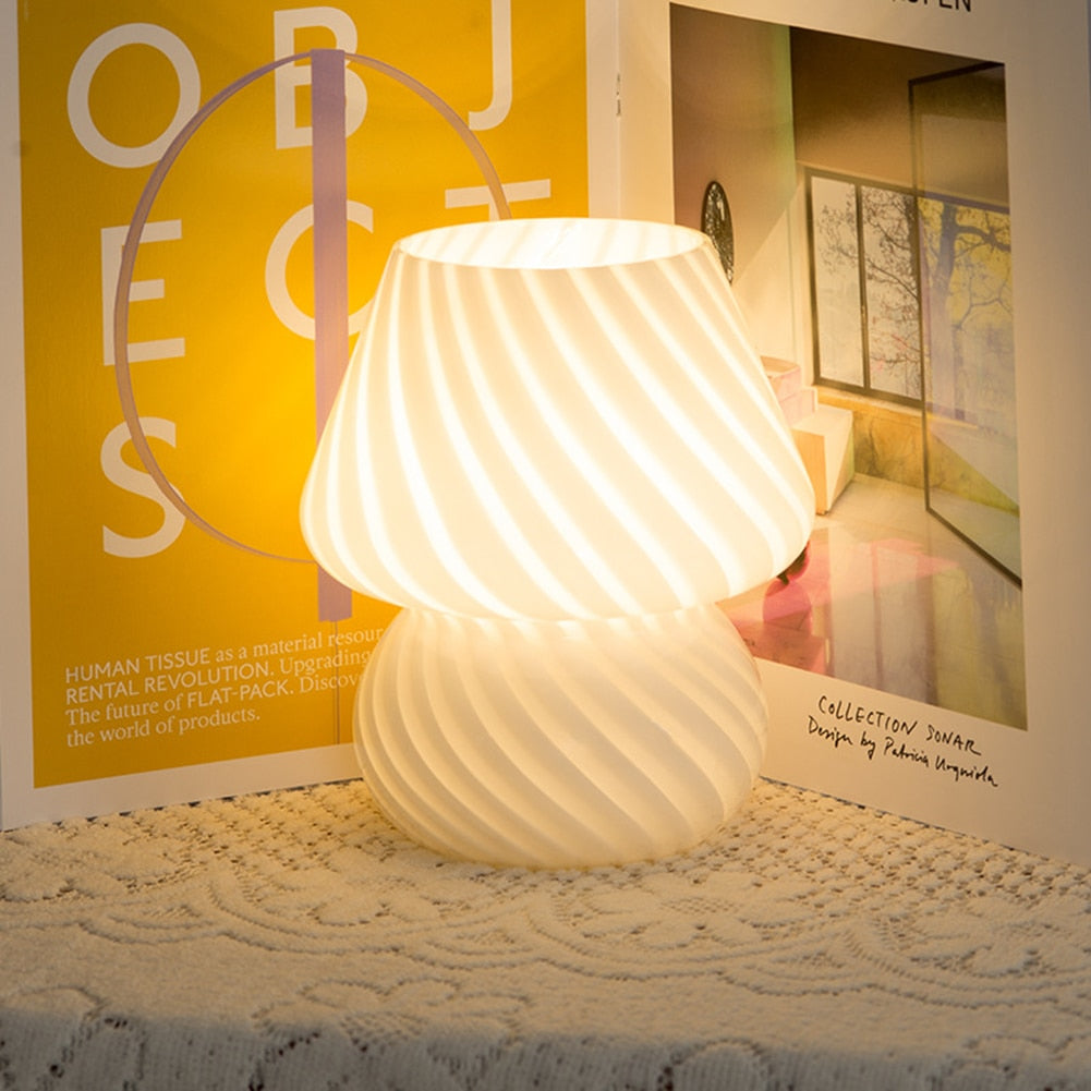 A stylish Mushroom Table Lamp with a dimmable feature, showcasing its elegant design and compact size.